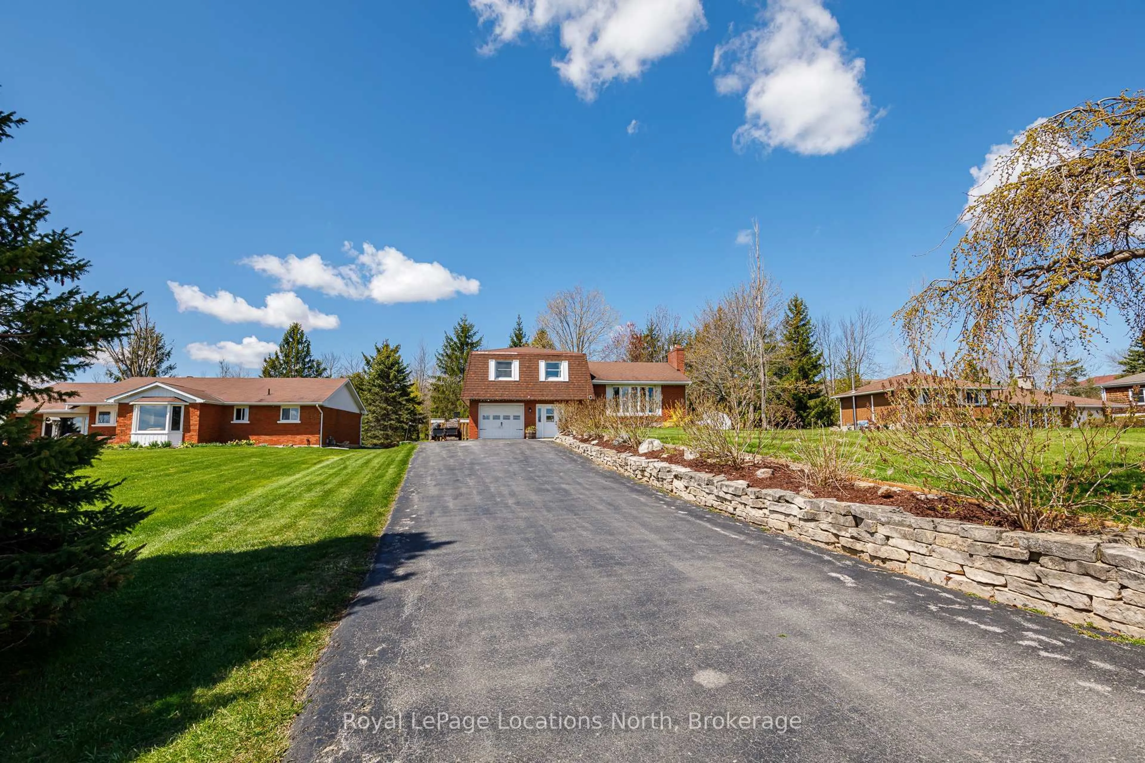 A pic from outside/outdoor area/front of a property/back of a property/a pic from drone, street for 78130 11th Line, Meaford Ontario N4L 1W5