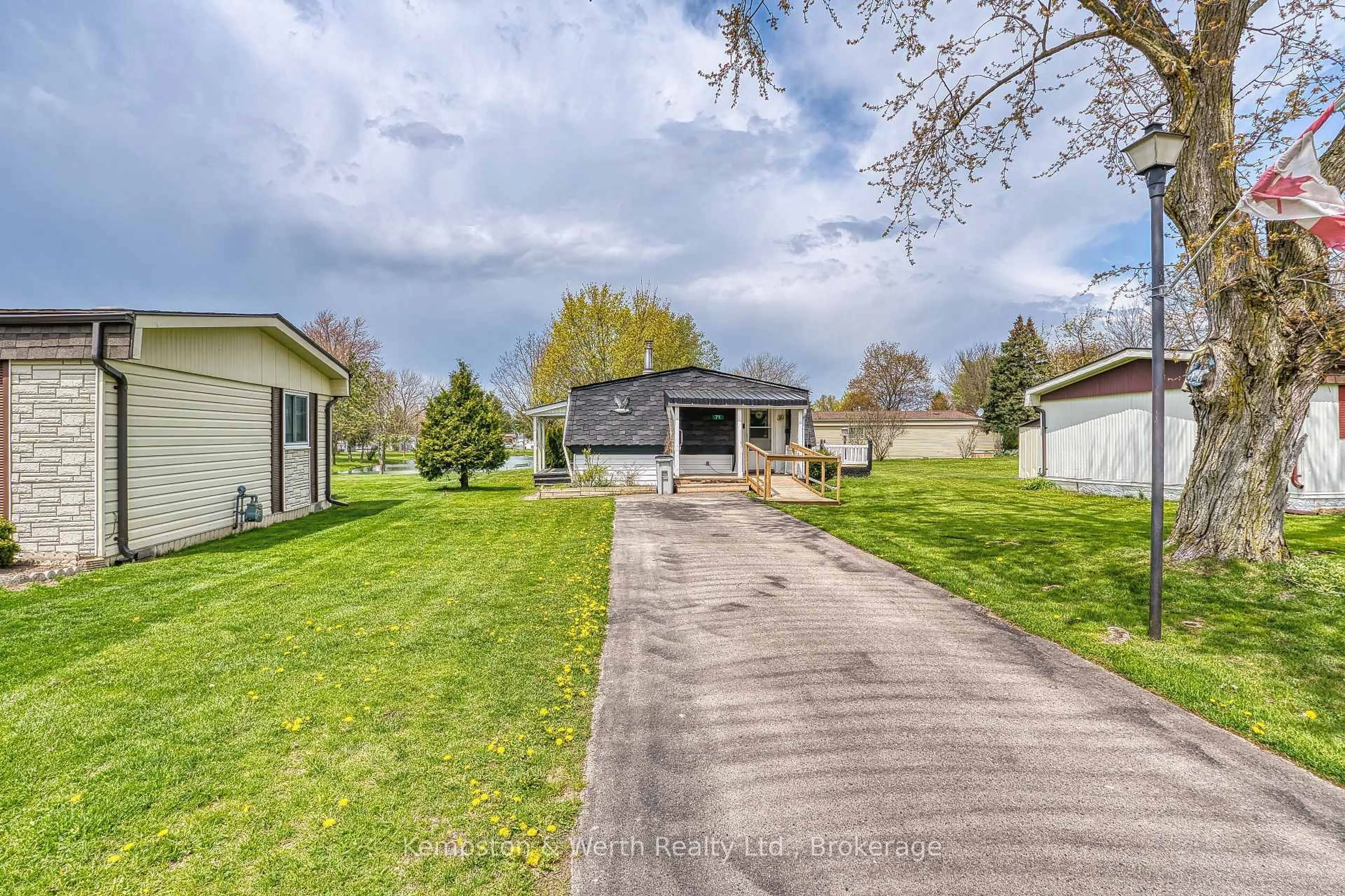A pic from outside/outdoor area/front of a property/back of a property/a pic from drone, unknown for 71 Fairview Cres, North Perth Ontario N4W 3G8