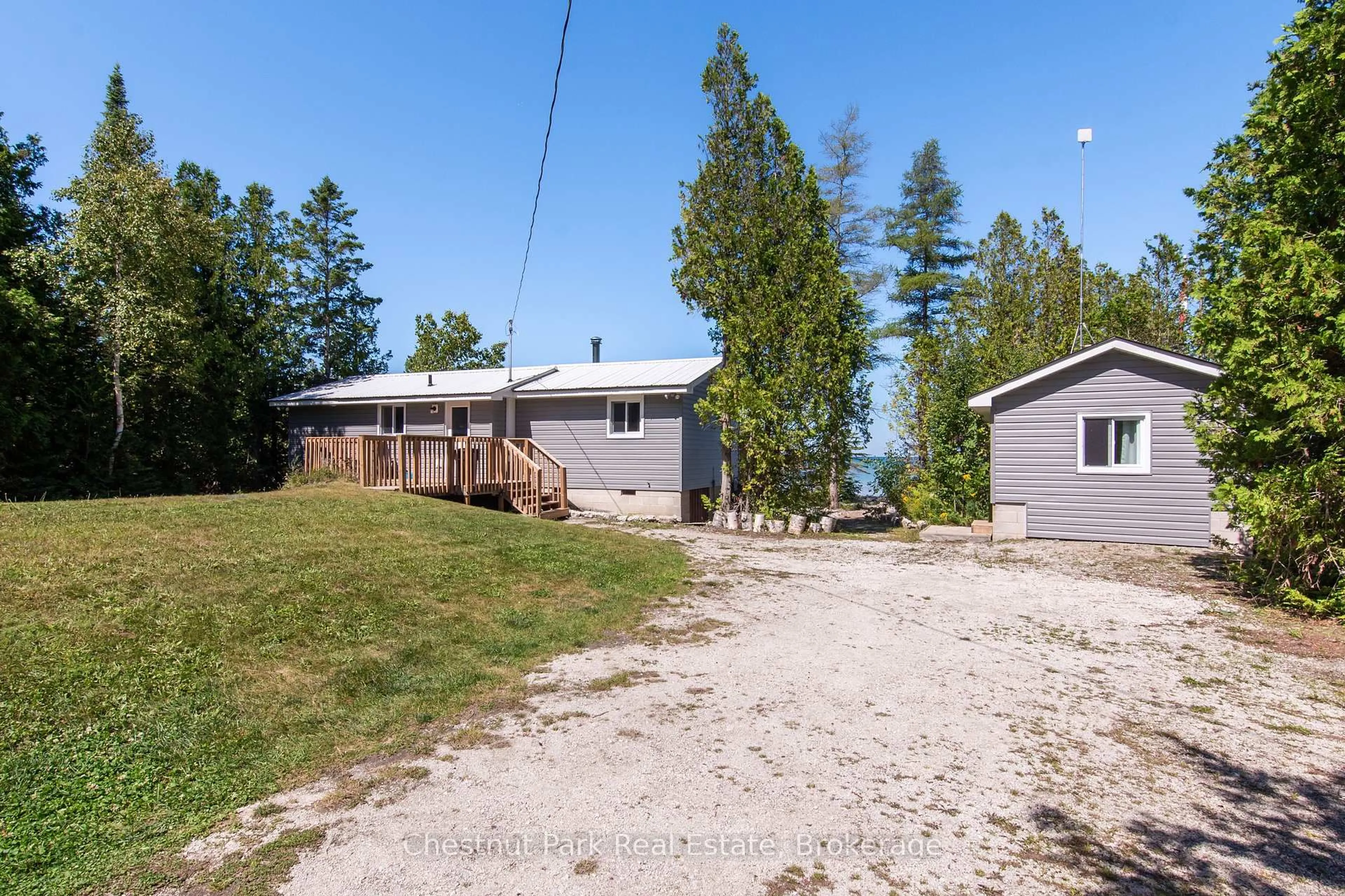 A pic from outside/outdoor area/front of a property/back of a property/a pic from drone, unknown for 37 RONALD St, Northern Bruce Peninsula Ontario N0H 1X0