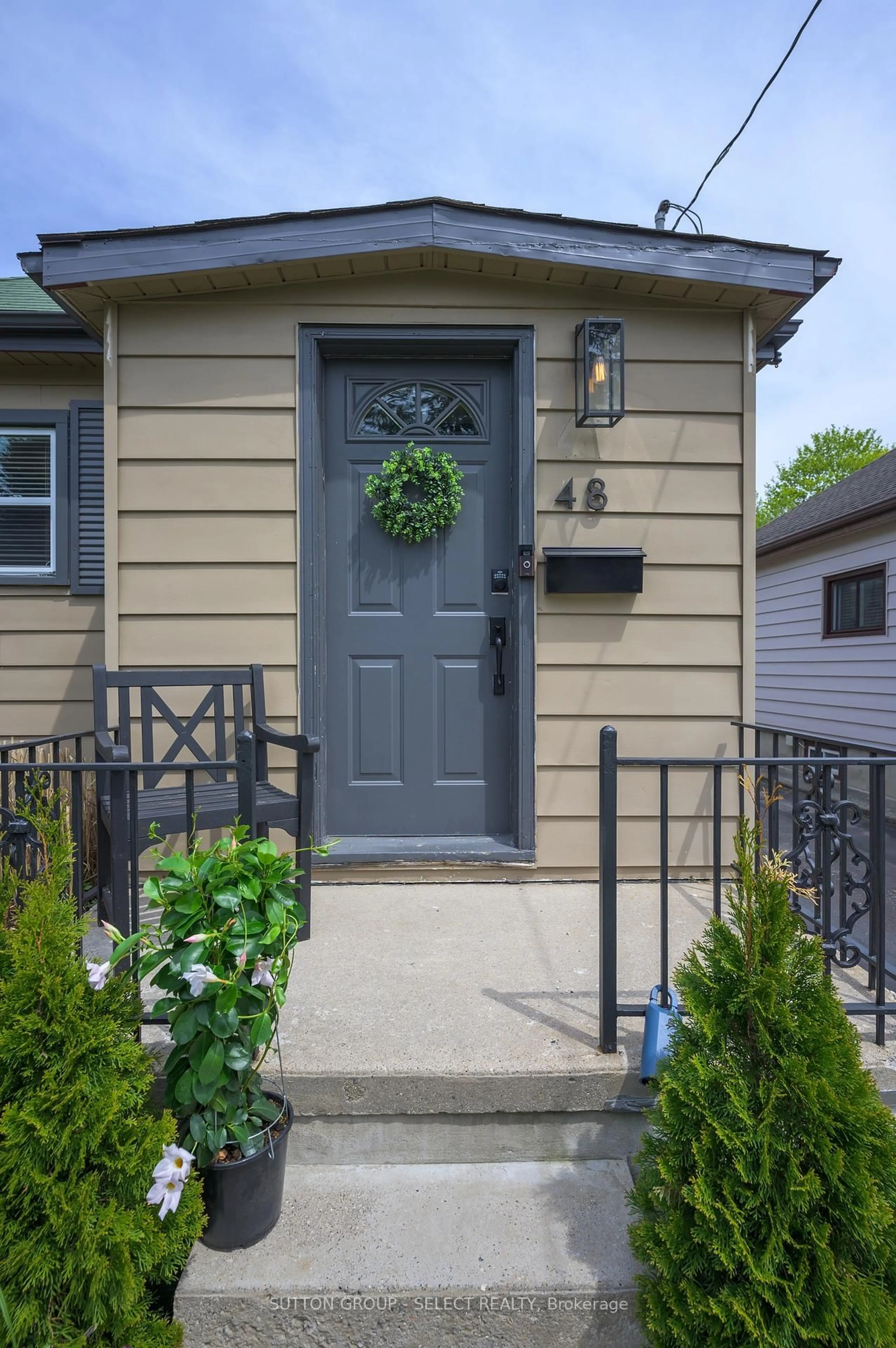 Home with vinyl exterior material, street for 48 Barker St, London East Ontario N5Y 1X6