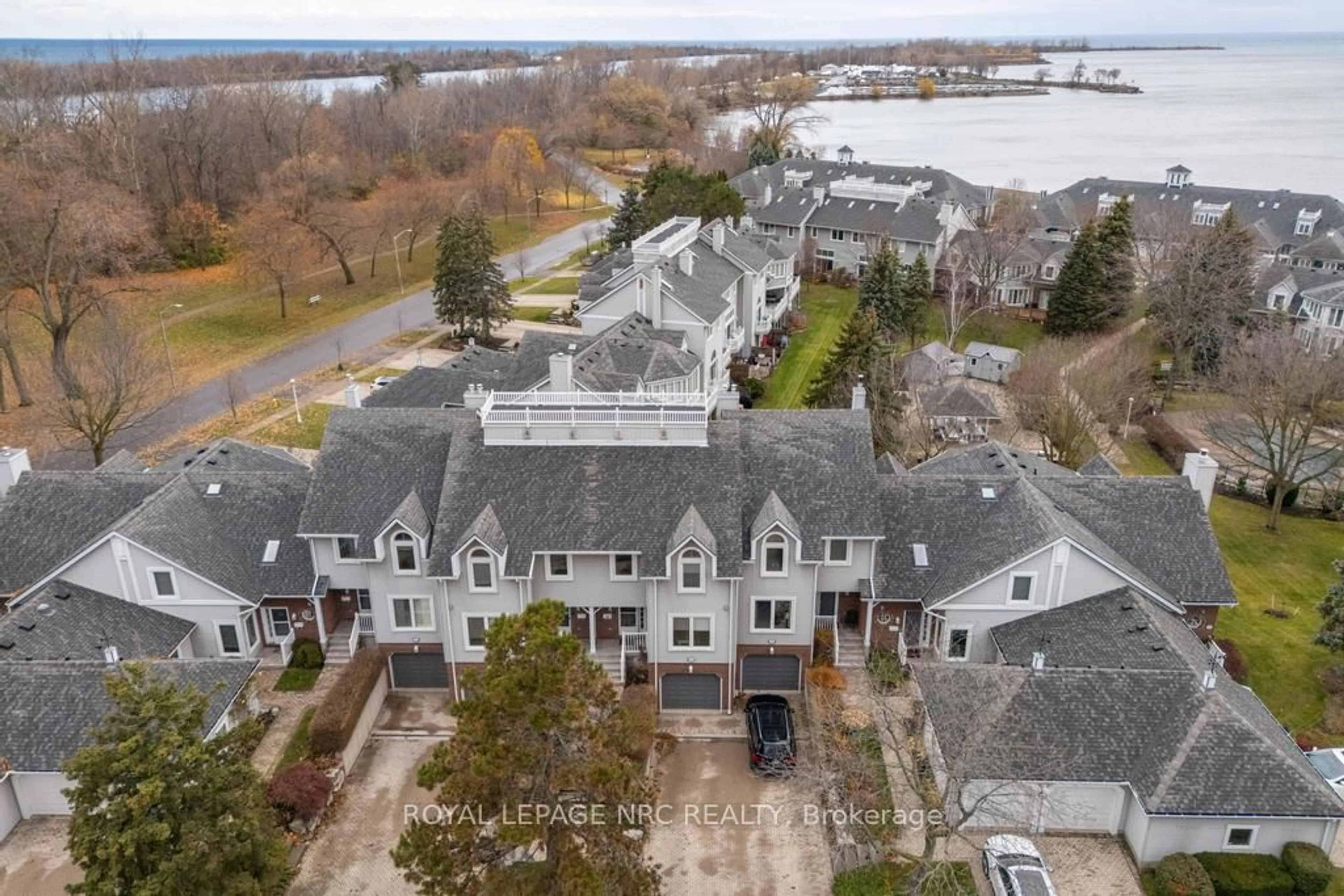 A pic from outside/outdoor area/front of a property/back of a property/a pic from drone, water/lake/river/ocean view for 1 Lakeside Dr #13, St. Catharines Ontario L2M 1P3