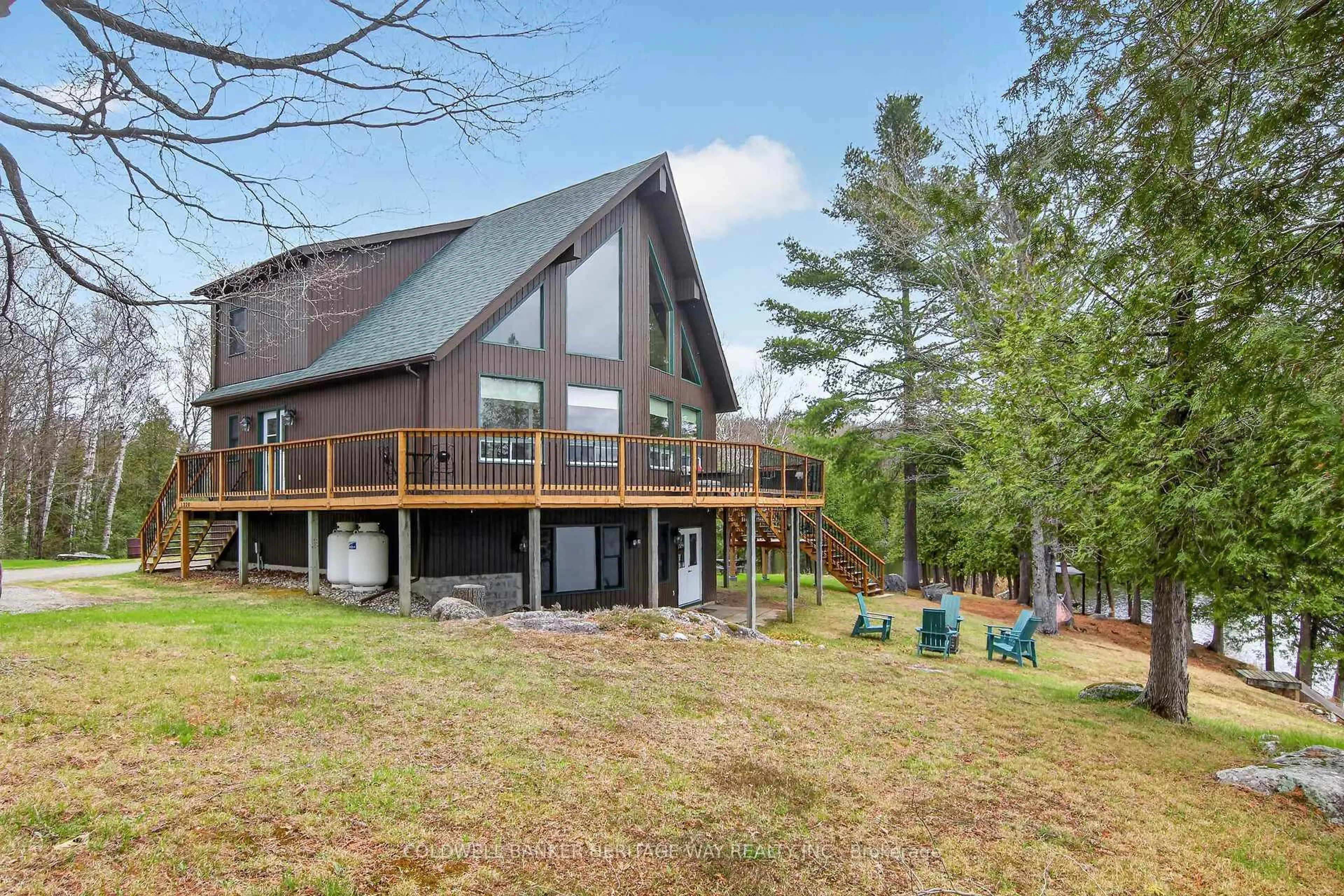 A pic from outside/outdoor area/front of a property/back of a property/a pic from drone, water/lake/river/ocean view for 1220 Thomas Lane, Ompah Ontario K0H 2J0