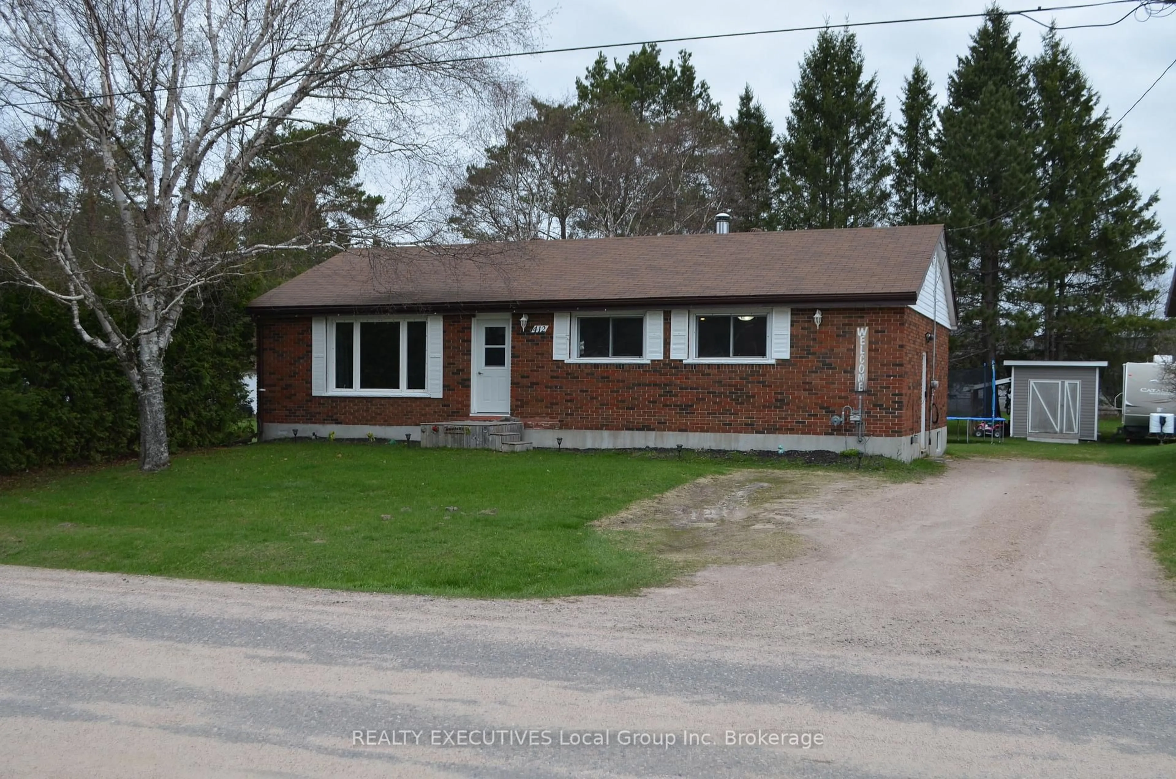 Home with brick exterior material, street for 412 Sweezy St, Powassan Ontario P0H 2L0