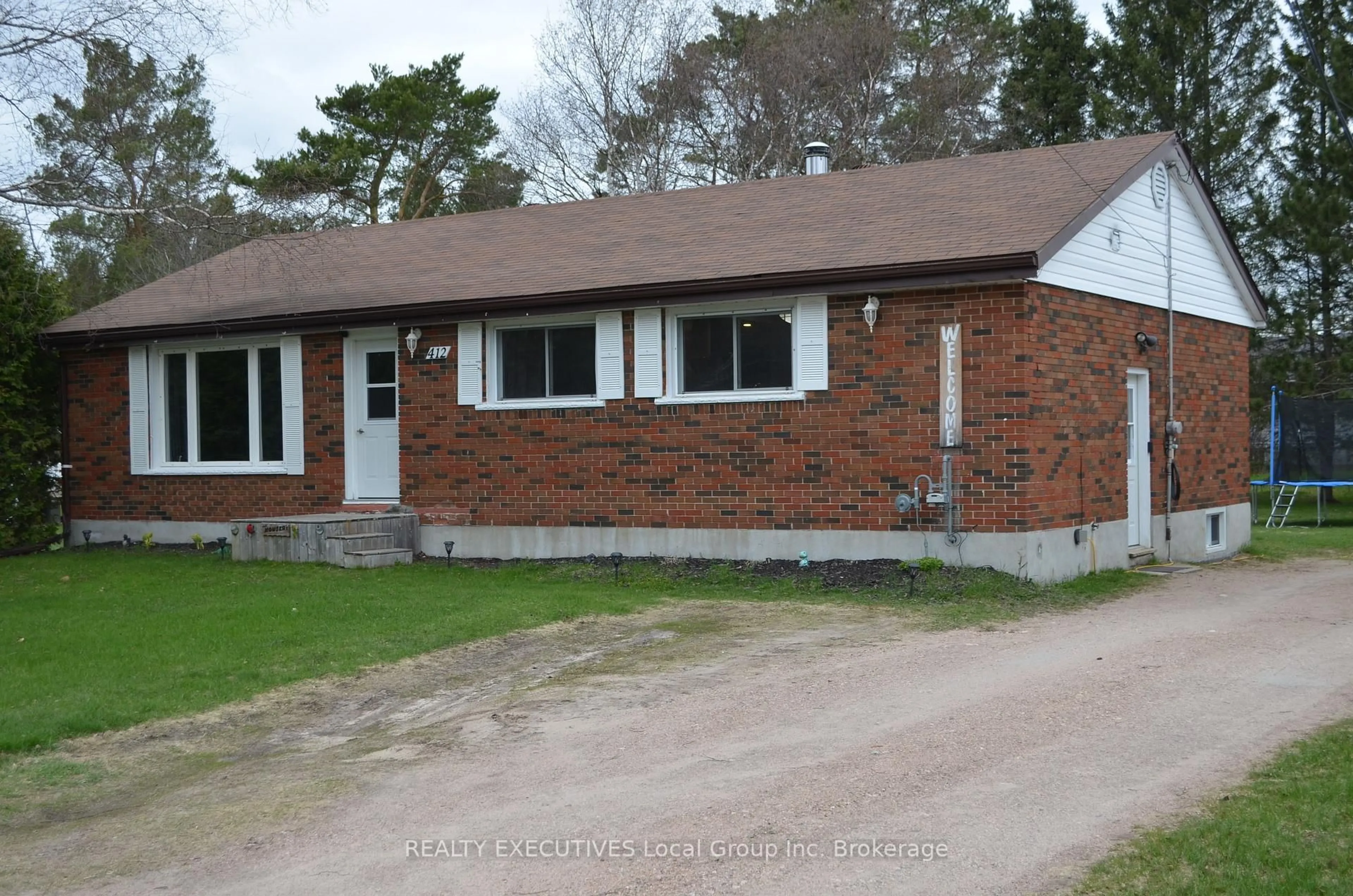 Home with brick exterior material, street for 412 Sweezy St, Powassan Ontario P0H 2L0