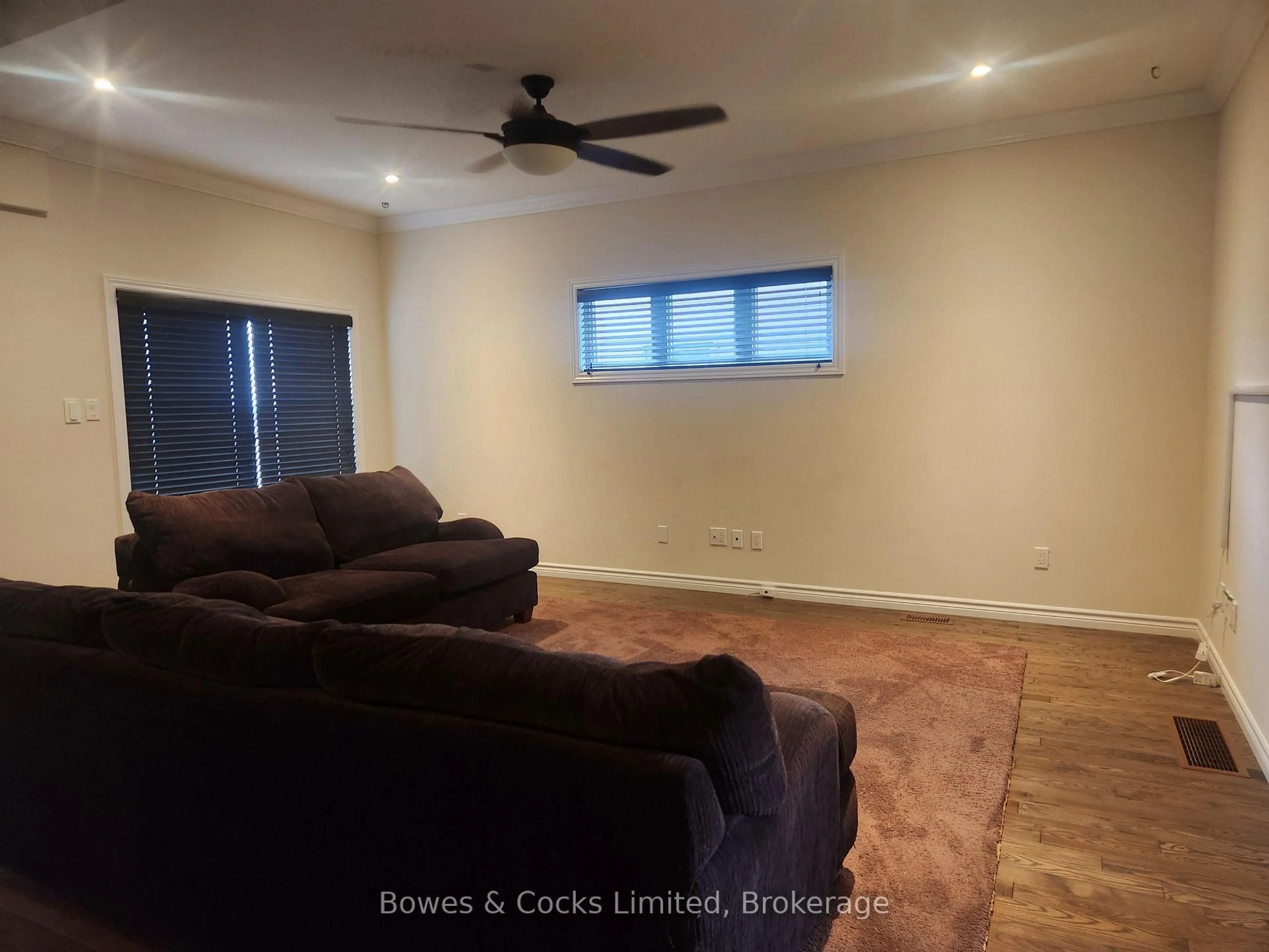 Living room with furniture, wood/laminate floor for 716 Sawmill Rd, Peterborough Ontario K9L 0G3
