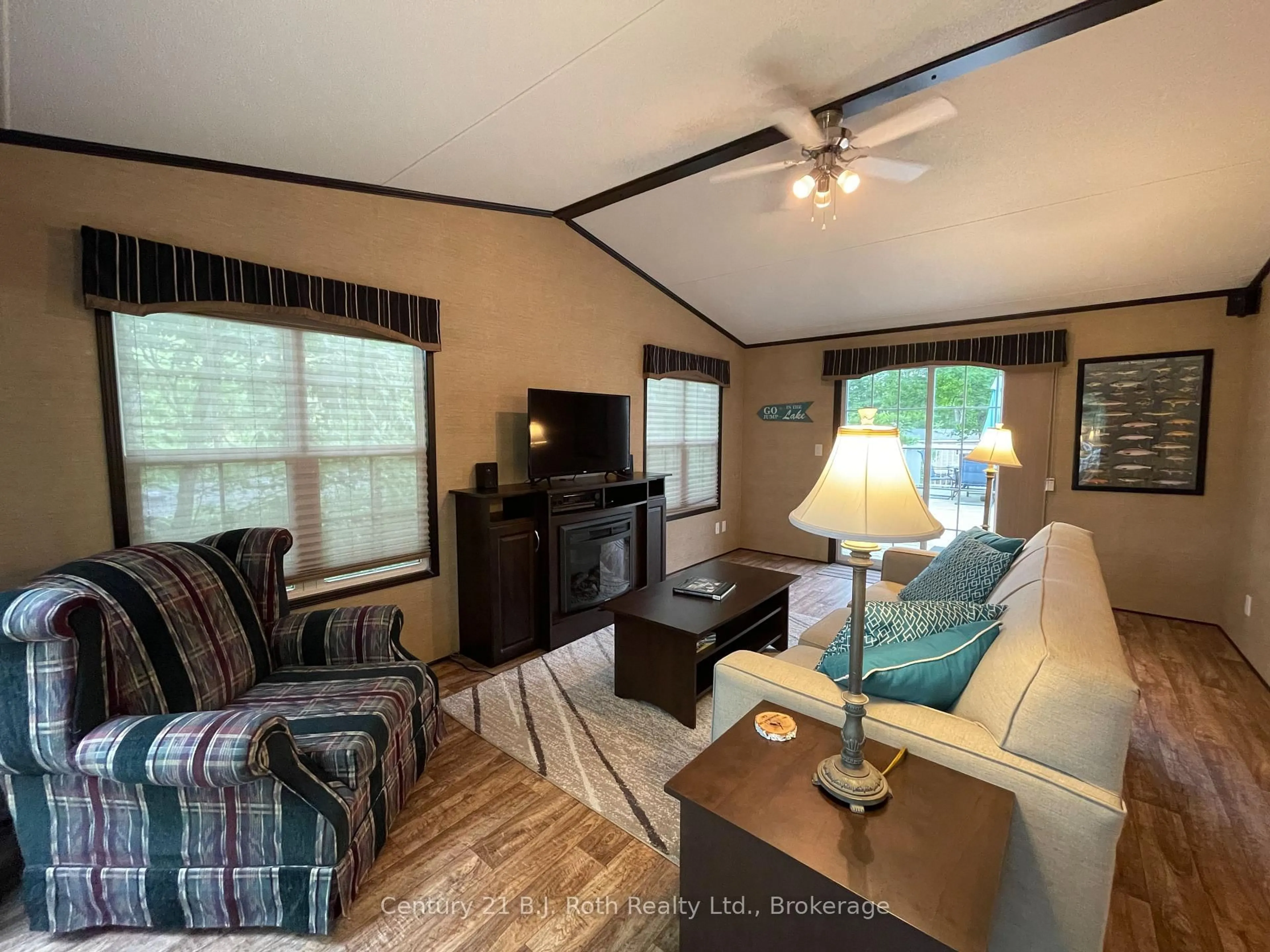 Living room with furniture, wood/laminate floor for 1336 SOUTH MORRISON LAKE Rd #18 Morrison Creek, Gravenhurst Ontario P0B 1L0