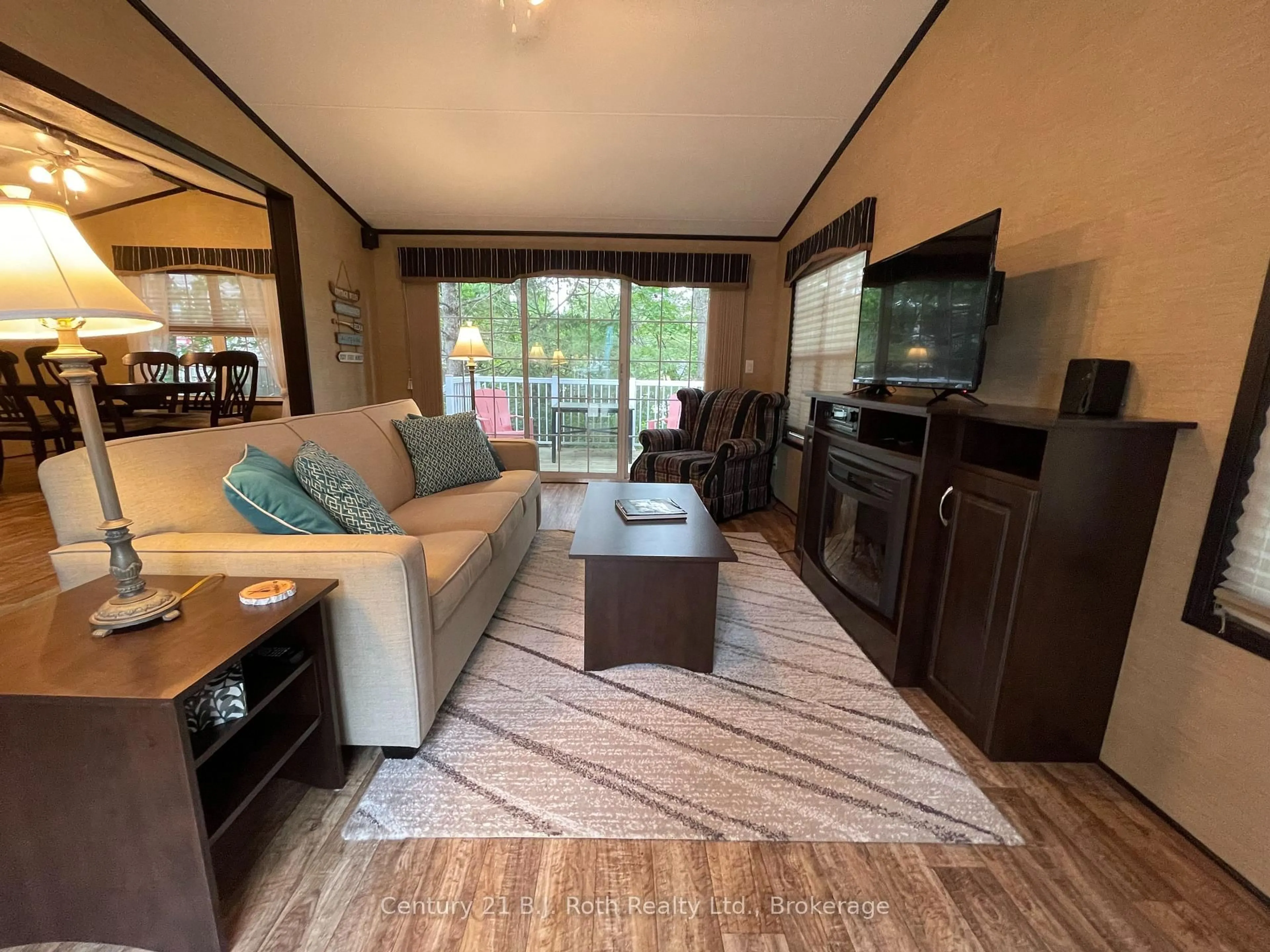 Living room with furniture, wood/laminate floor for 1336 SOUTH MORRISON LAKE Rd #18 Morrison Creek, Gravenhurst Ontario P0B 1L0