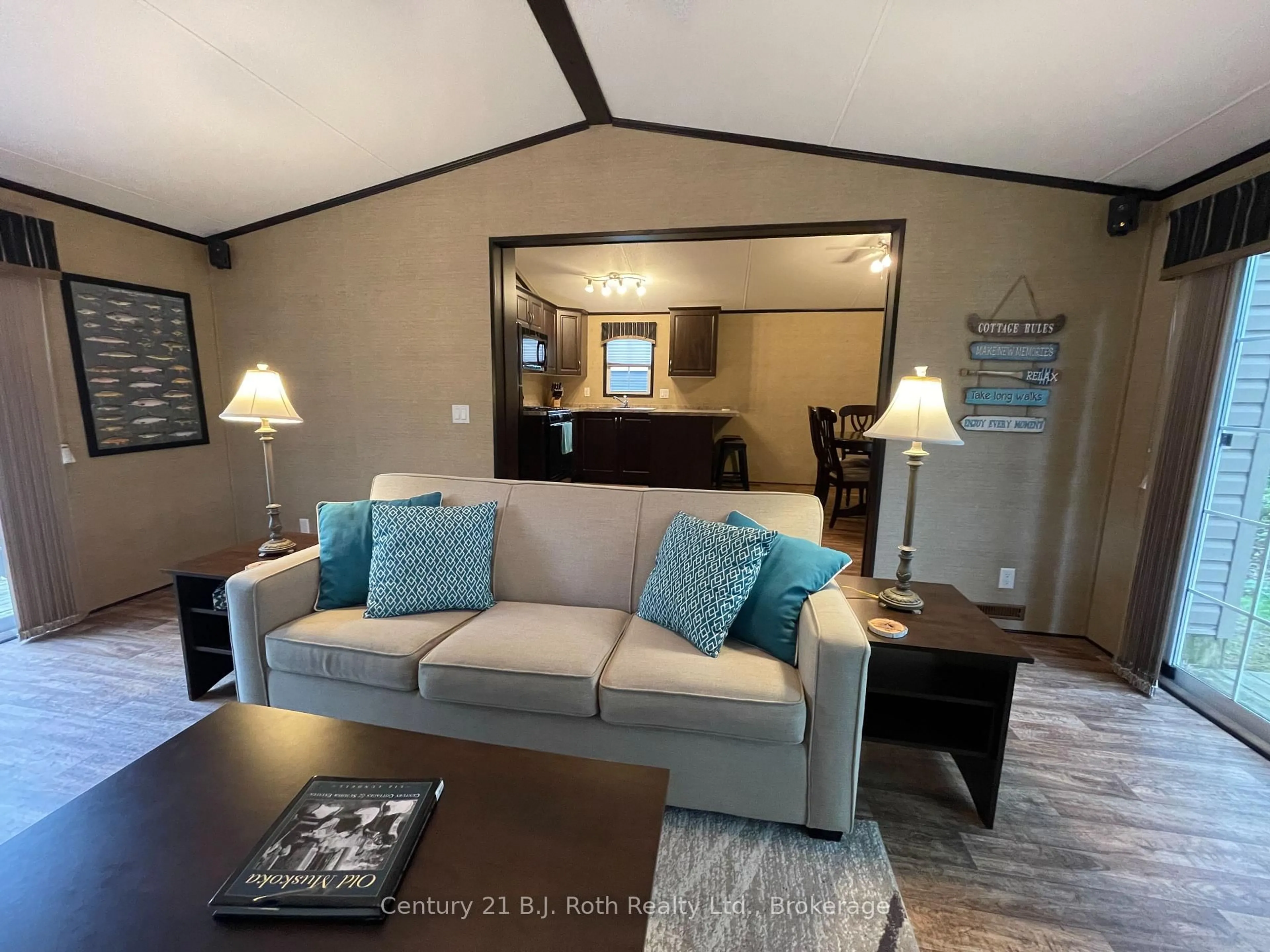 Living room with furniture, wood/laminate floor for 1336 SOUTH MORRISON LAKE Rd #18 Morrison Creek, Gravenhurst Ontario P0B 1L0