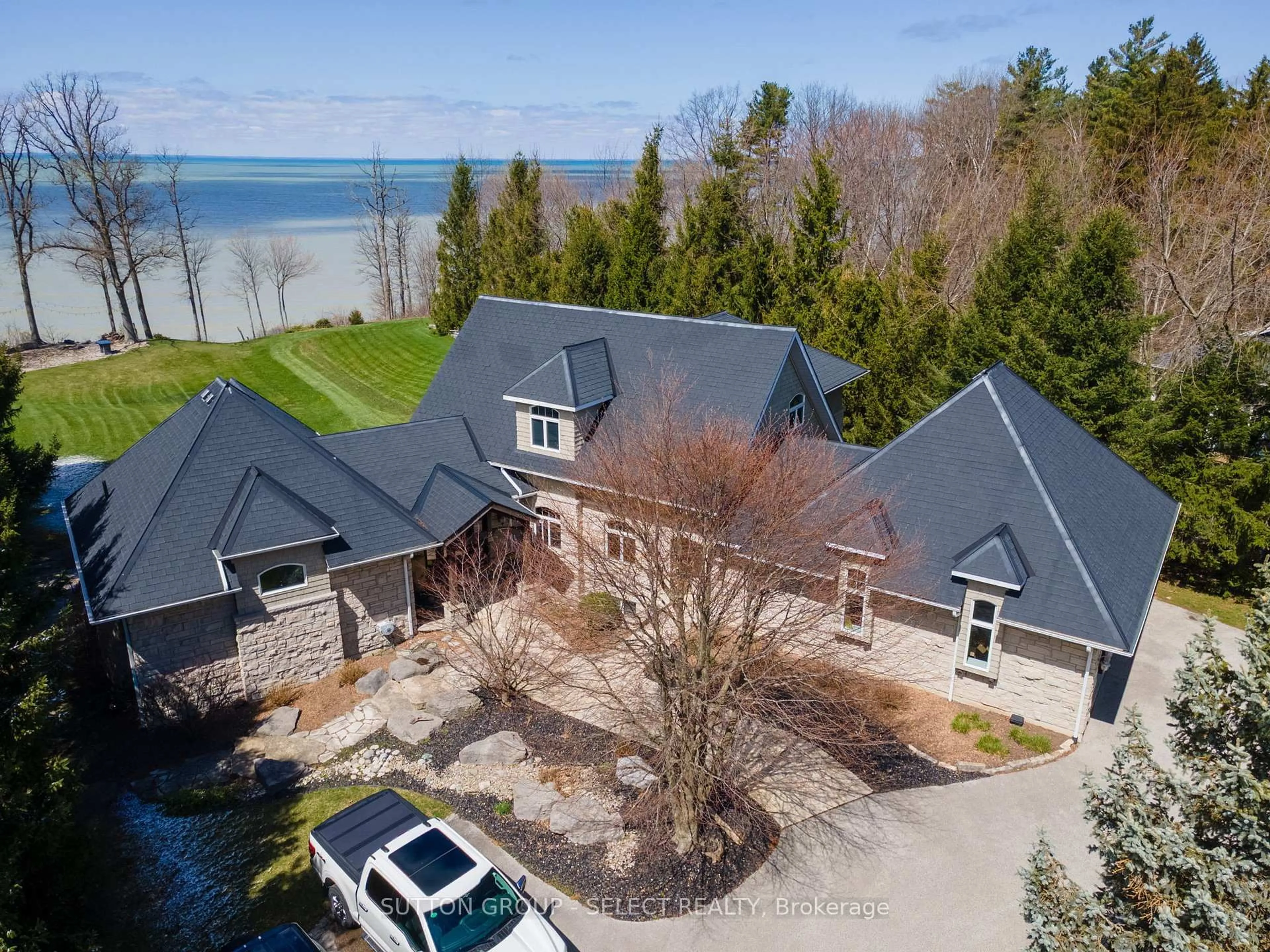 A pic from outside/outdoor area/front of a property/back of a property/a pic from drone, water/lake/river/ocean view for 4544 Lakeshore Rd, Plympton-Wyoming Ontario N0N 1J6