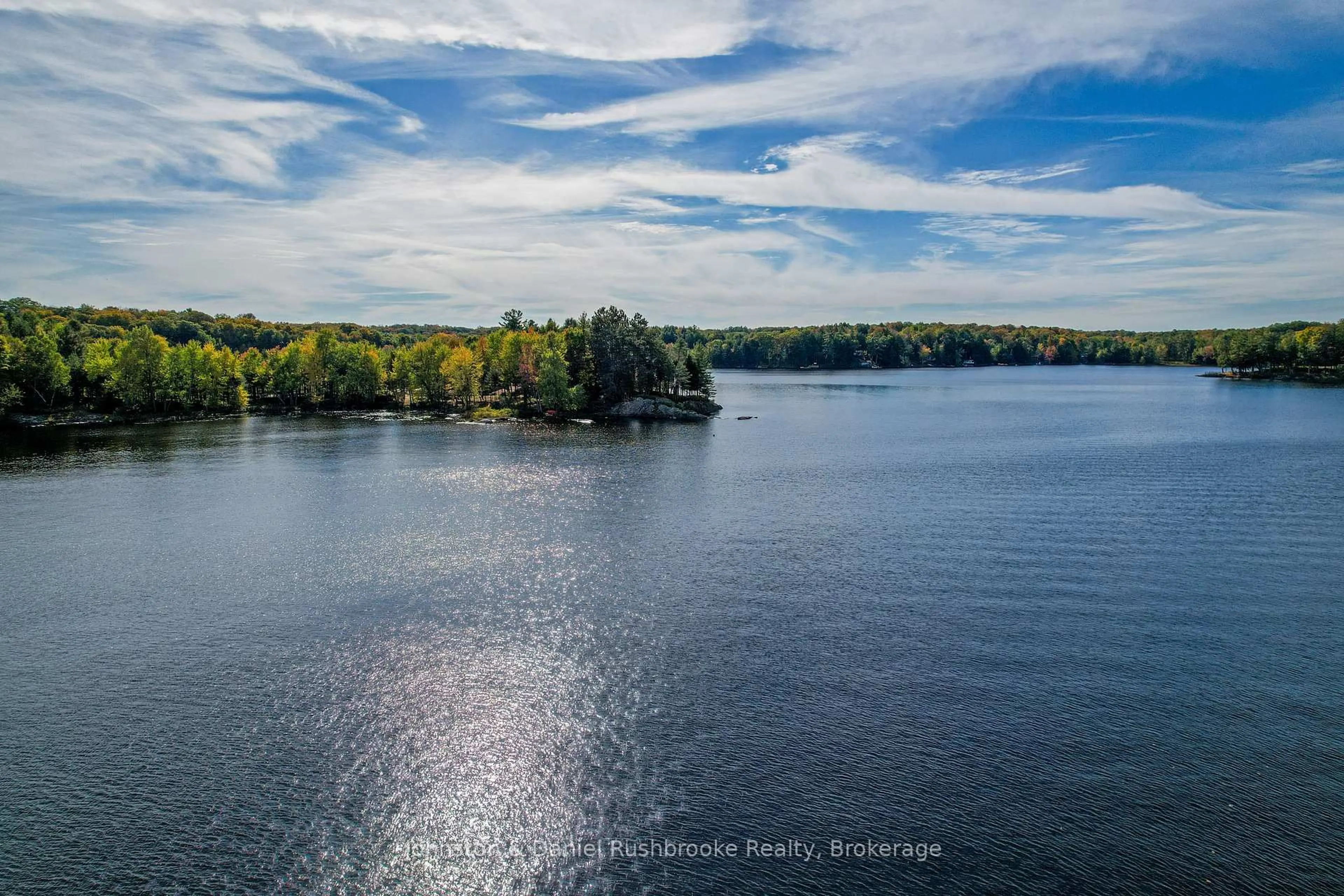 A pic from outside/outdoor area/front of a property/back of a property/a pic from drone, water/lake/river/ocean view for 1042 El-Kee Point Lane, Muskoka Lakes Ontario P0B 1J0