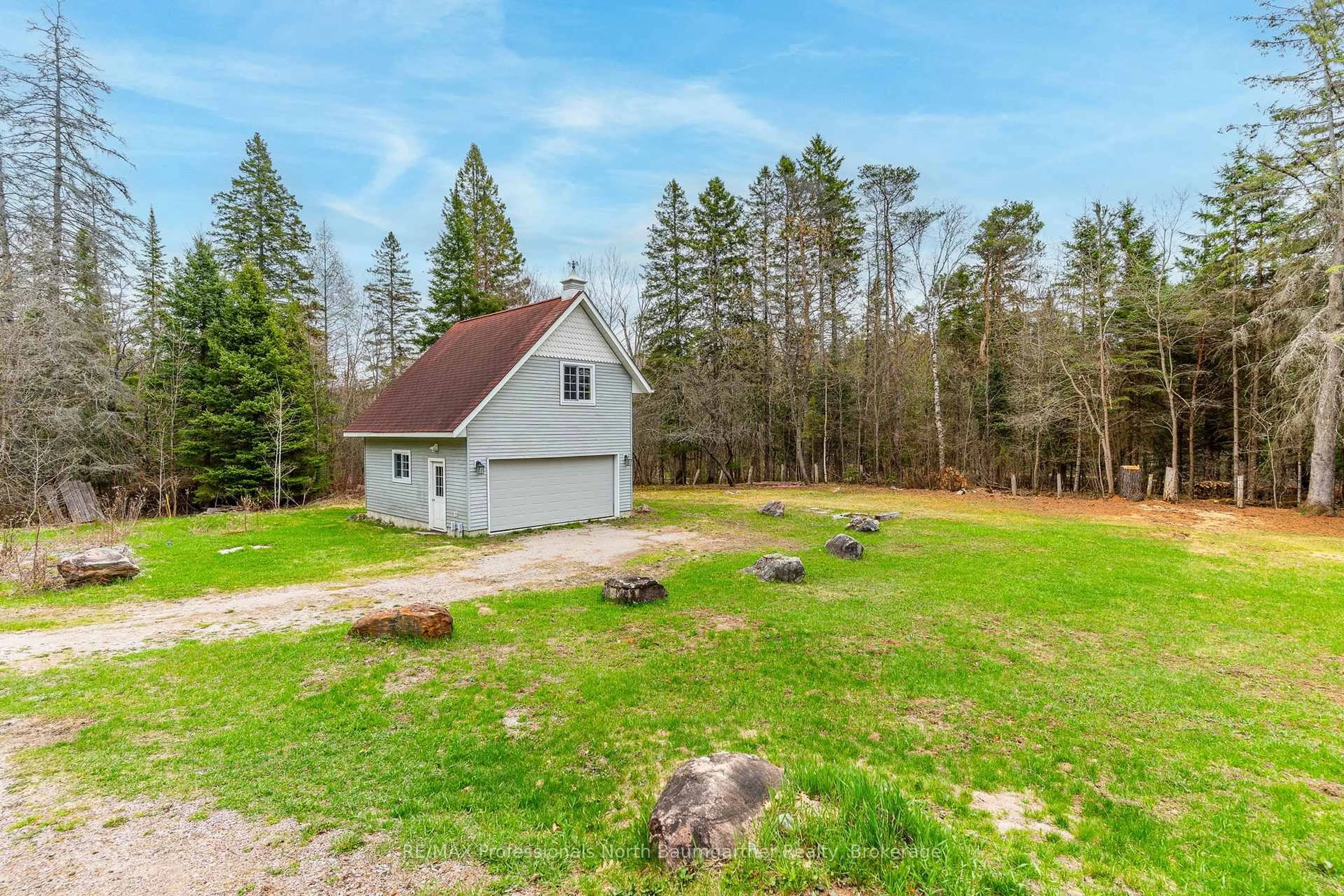 A pic from outside/outdoor area/front of a property/back of a property/a pic from drone, forest/trees view for 10752 County Road 503, Highlands East Ontario K0M 1R0