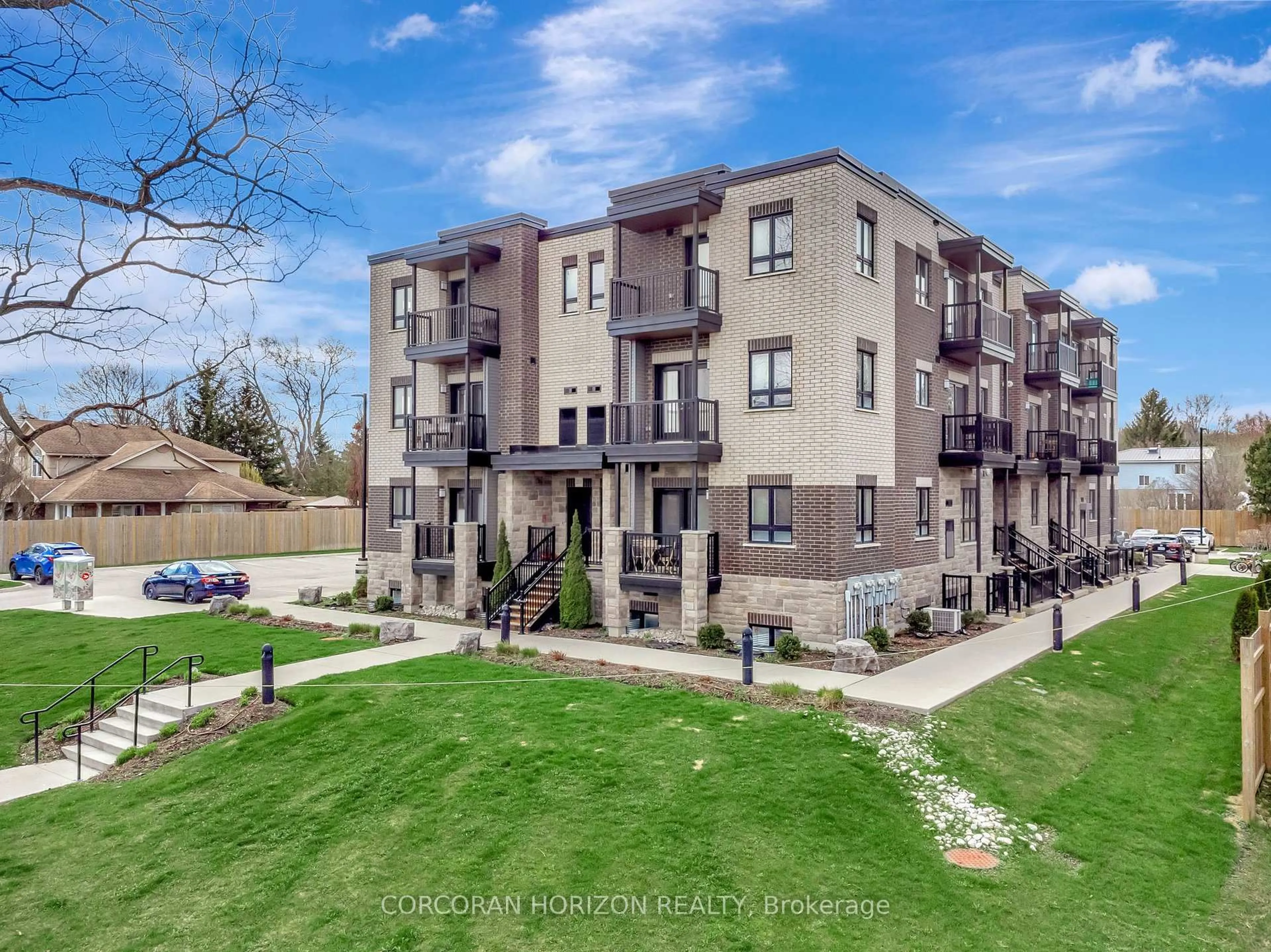 A pic from outside/outdoor area/front of a property/back of a property/a pic from drone, street for 408 Guelph Ave #209, Cambridge Ontario N3C 0H3