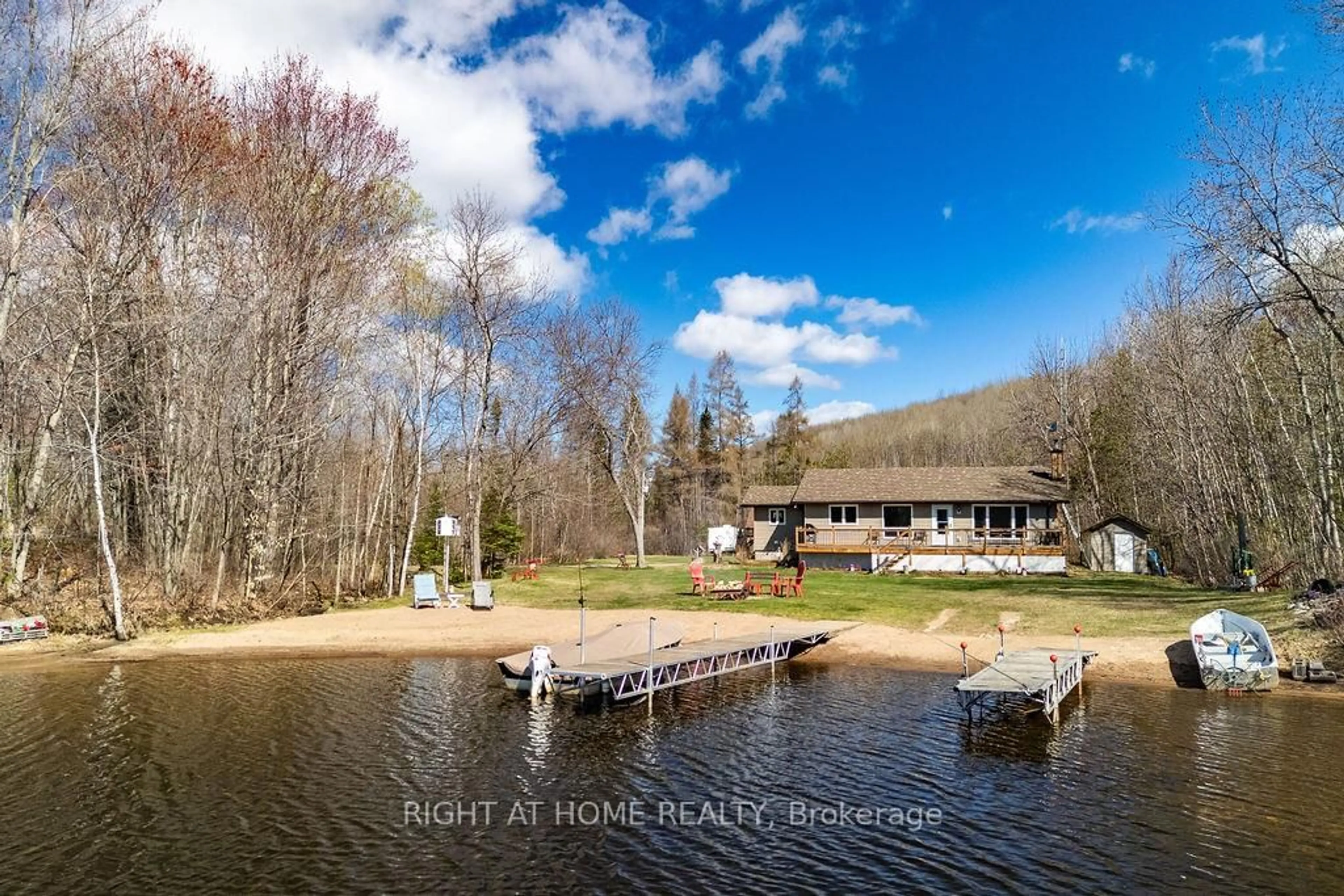 A pic from outside/outdoor area/front of a property/back of a property/a pic from drone, water/lake/river/ocean view for 61C Blackfish Bay Rd Rd, Combermere Ontario K0J 1L0