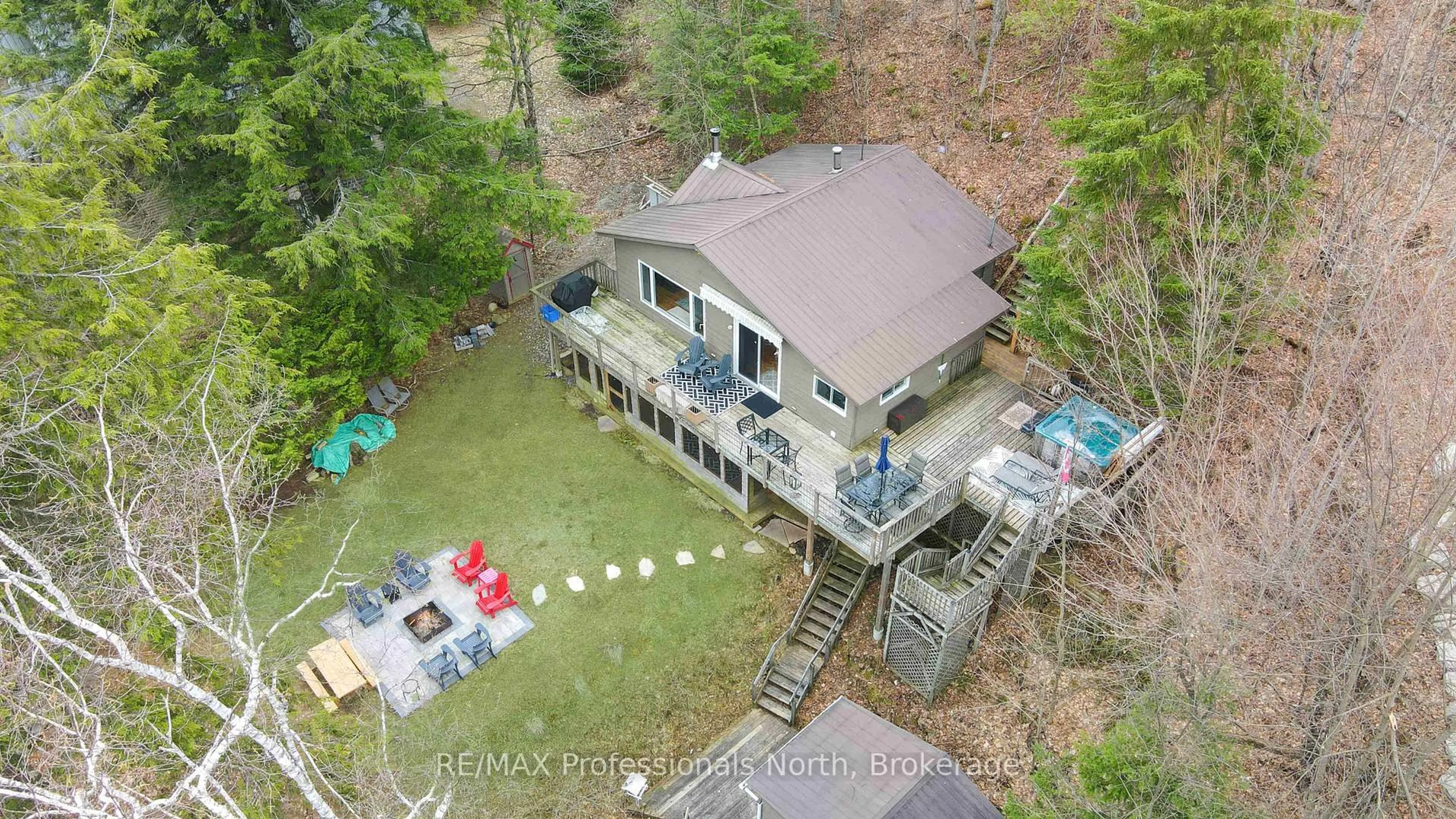 A pic from outside/outdoor area/front of a property/back of a property/a pic from drone, water/lake/river/ocean view for 1110 Miskwabi Lake Rd, Dysart et al Ontario K0M 1S0