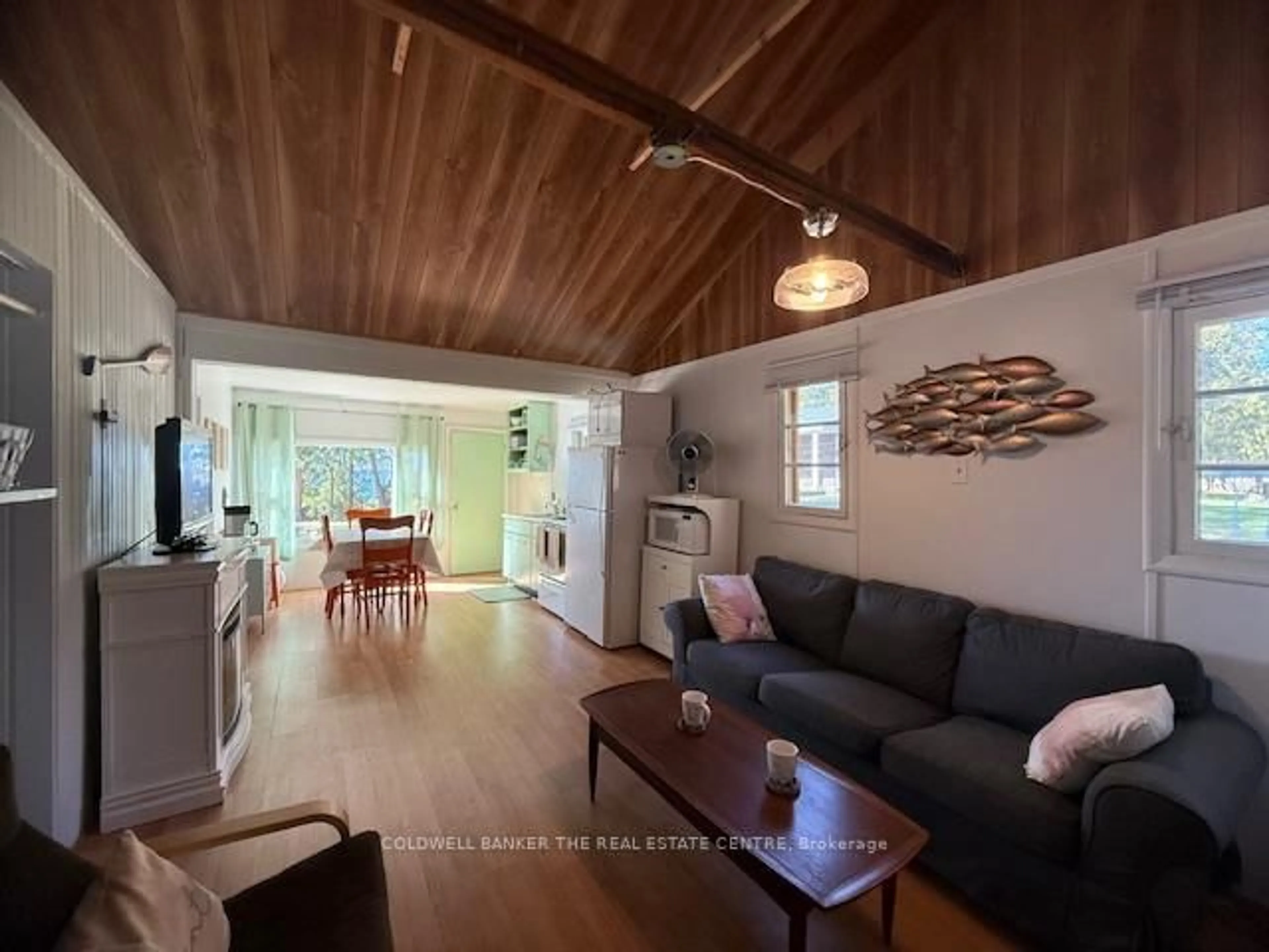 Living room with furniture, wood/laminate floor for 227 Sunset Beach Rd, Kawartha Lakes Ontario K0M 2B0