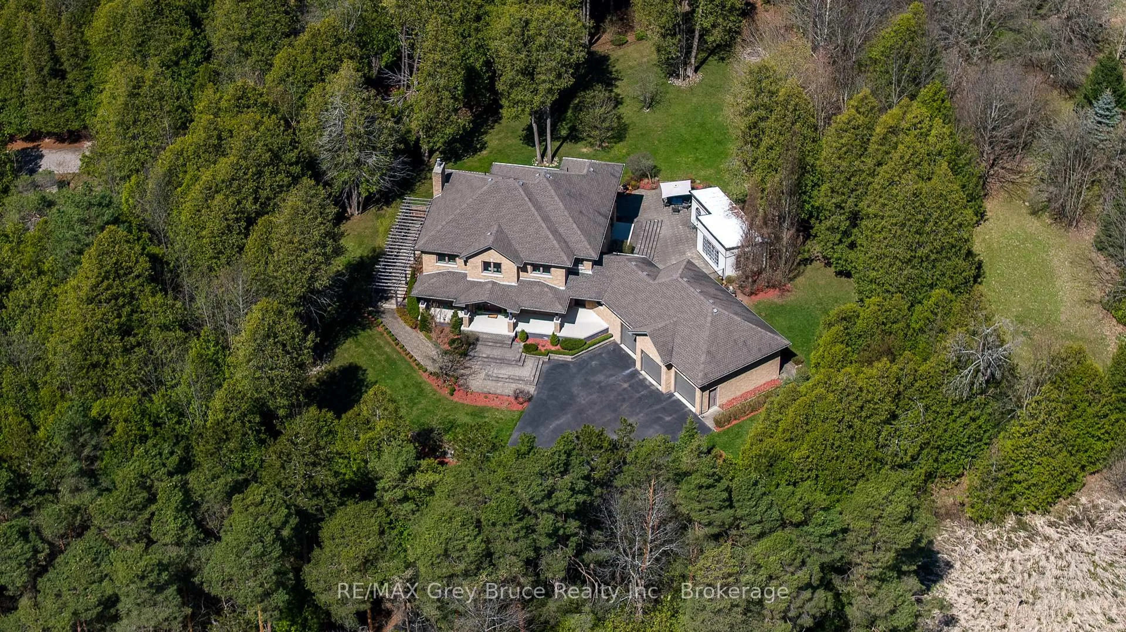 A pic from outside/outdoor area/front of a property/back of a property/a pic from drone, street for 318760 Grey Road 1, Georgian Bluffs Ontario N4K 5N4