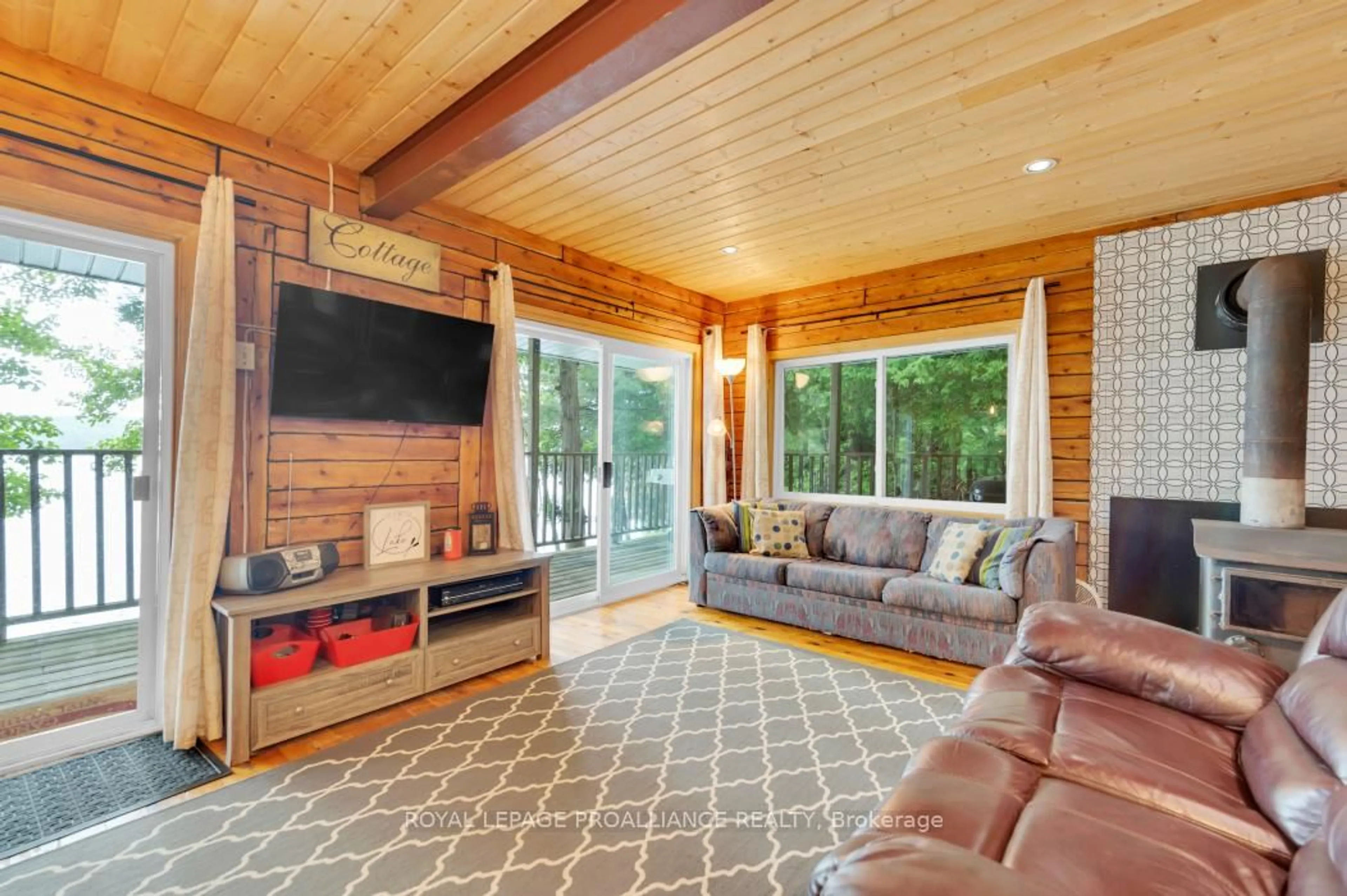 Living room with furniture, unknown for 10520 Mazinaw Lake Access, Cloyne Ontario K0H 1K0