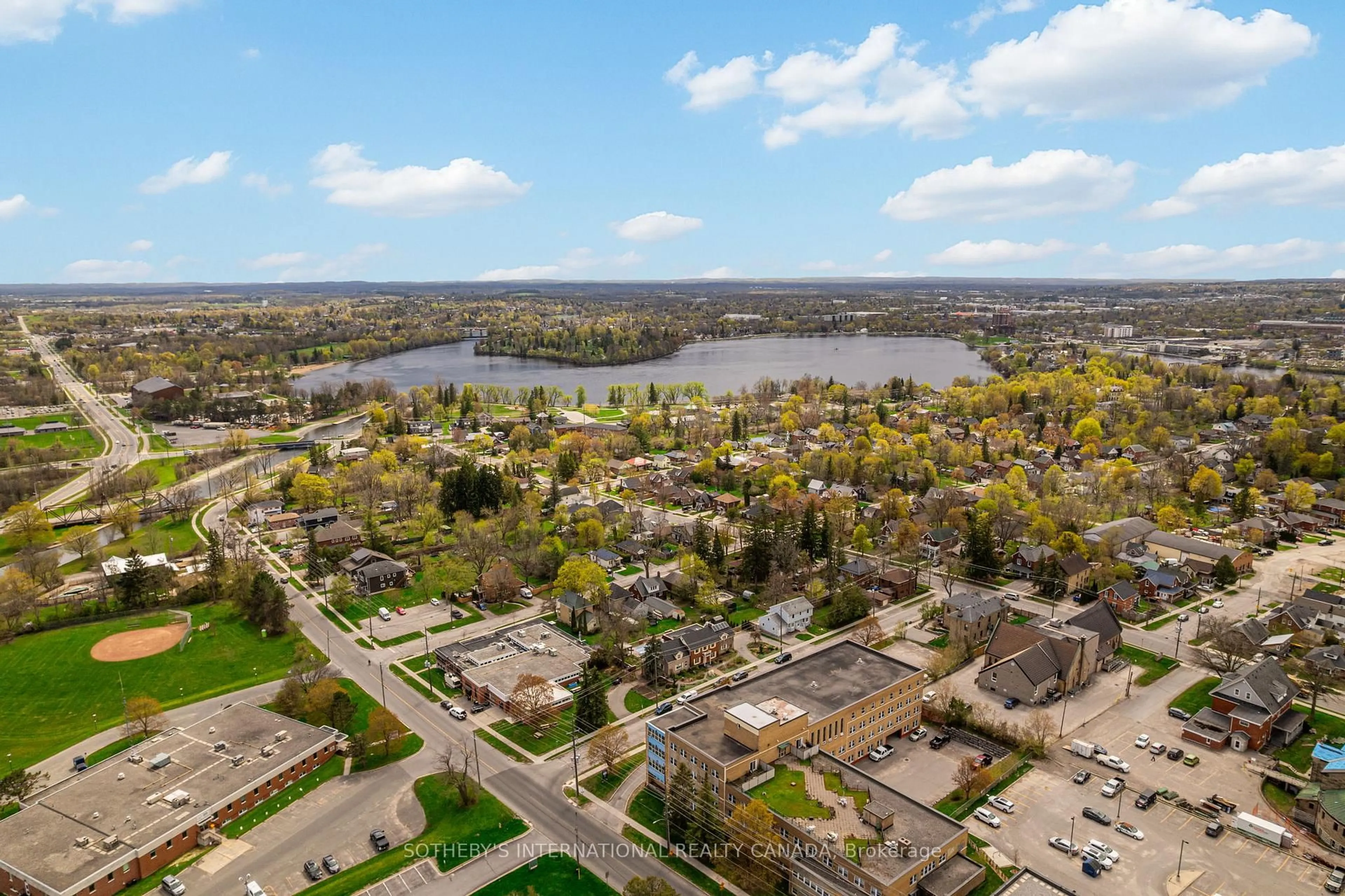 A pic from outside/outdoor area/front of a property/back of a property/a pic from drone, water/lake/river/ocean view for 195 Hunter St #TH 105, Peterborough Ontario K9H 1G9