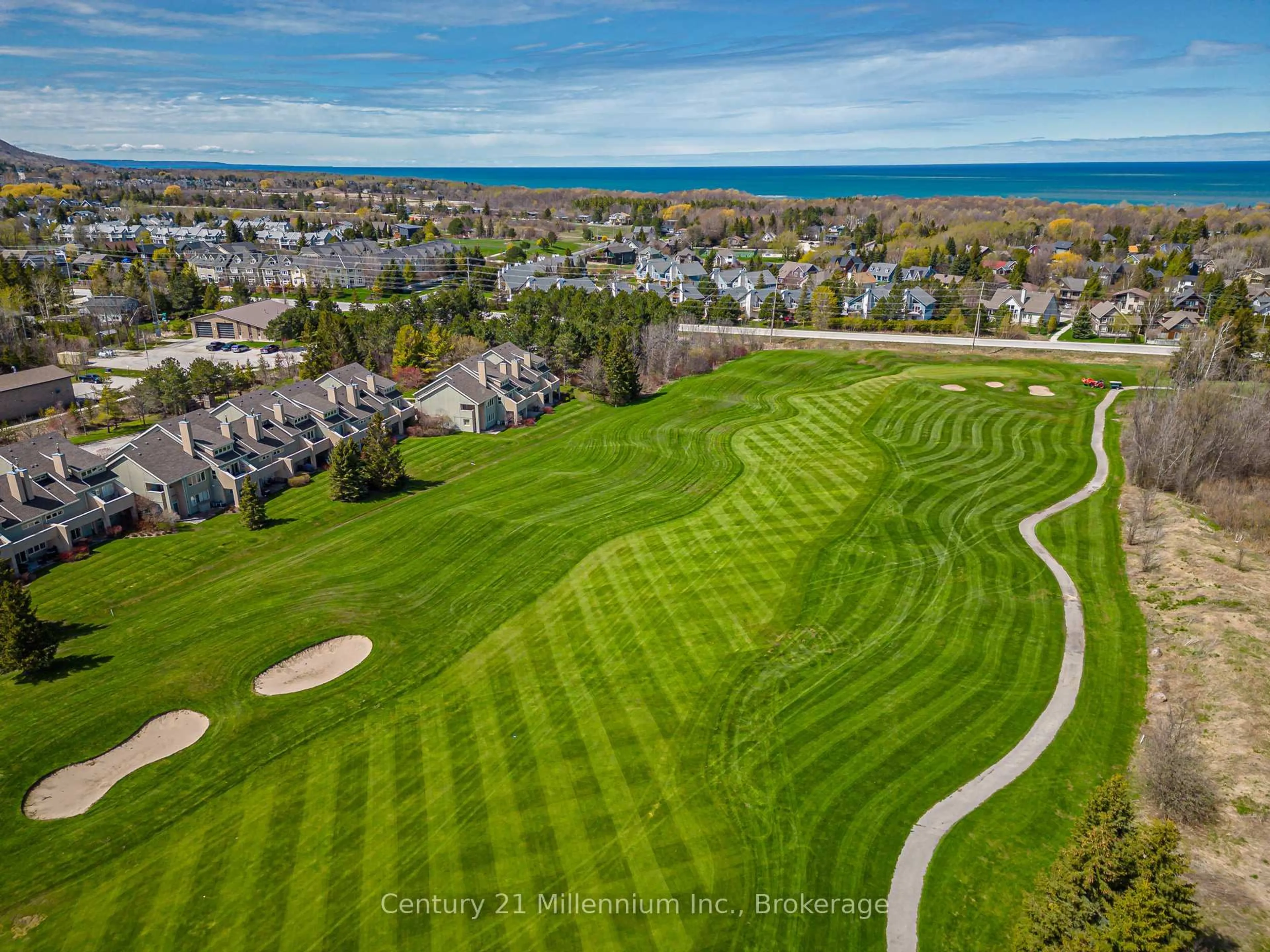 A pic from outside/outdoor area/front of a property/back of a property/a pic from drone, water/lake/river/ocean view for 110 Fairway Crt #105, Blue Mountains Ontario L9Y 0P8