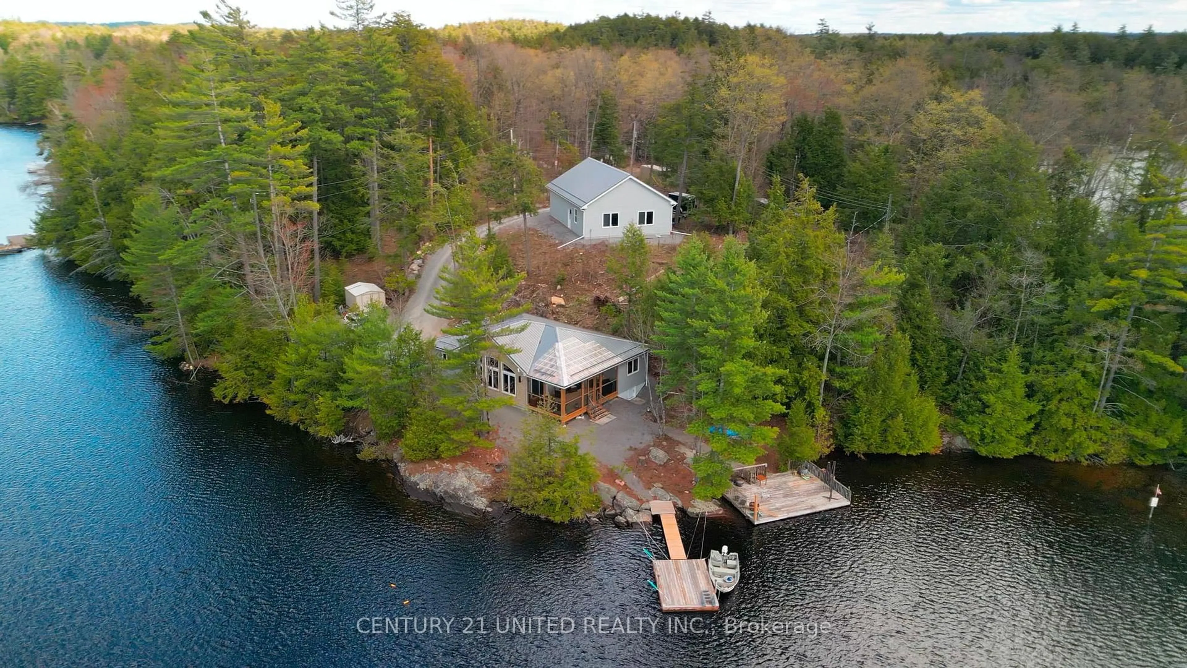 A pic from outside/outdoor area/front of a property/back of a property/a pic from drone, water/lake/river/ocean view for 44 Fire Route 223, Trent Lakes Ontario K0L 1J0