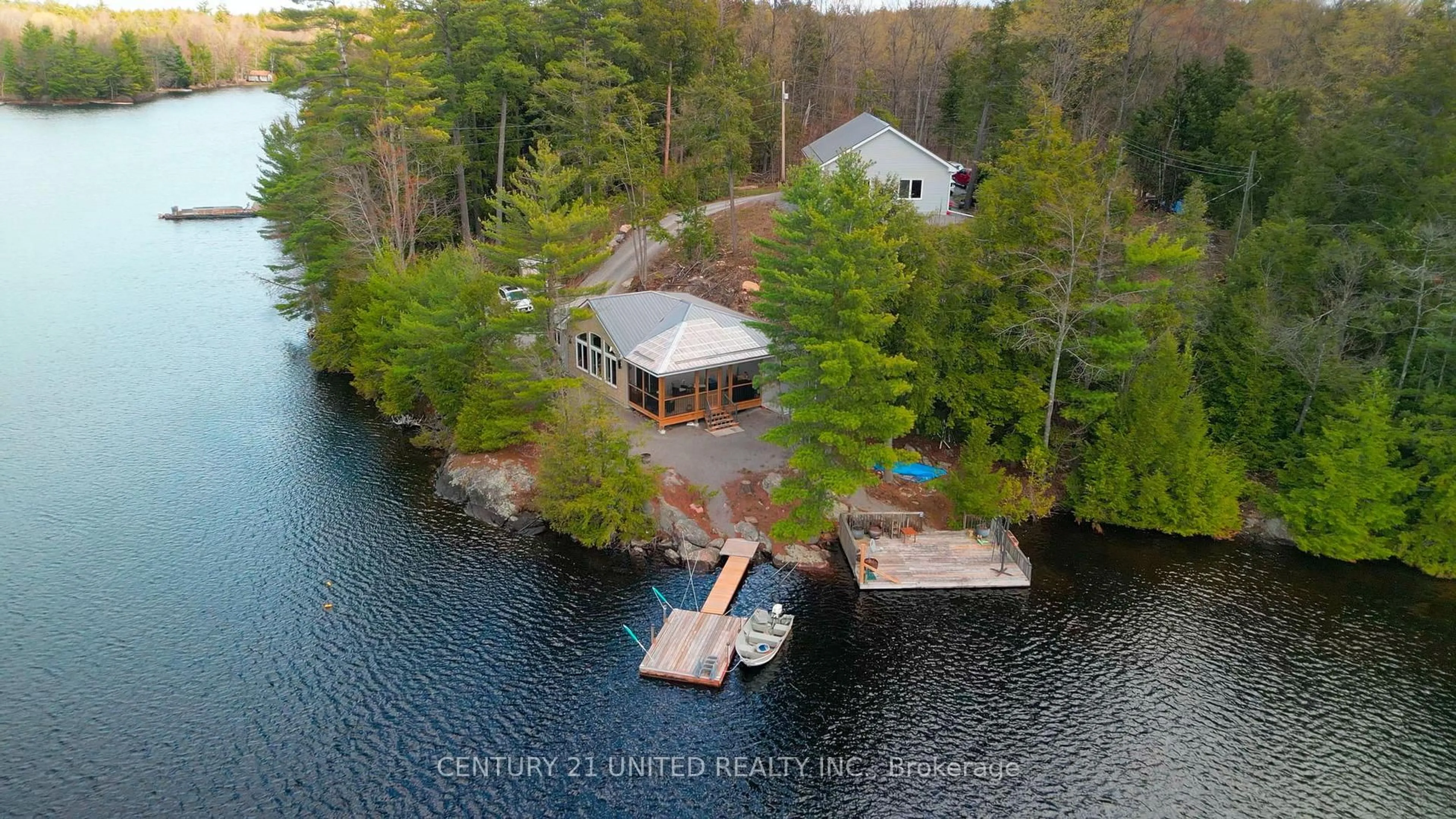 A pic from outside/outdoor area/front of a property/back of a property/a pic from drone, water/lake/river/ocean view for 44 Fire Route 223, Trent Lakes Ontario K0L 1J0