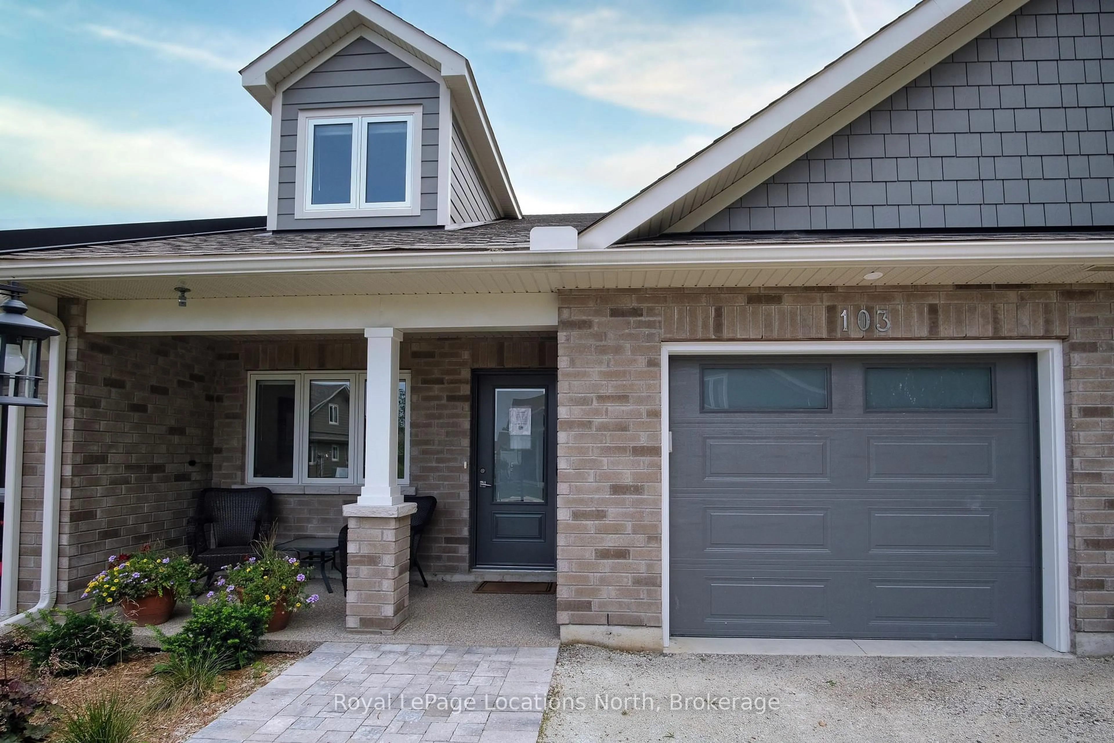 Home with brick exterior material, street for 103 Dove Dr, Blue Mountains Ontario N0H 2P0