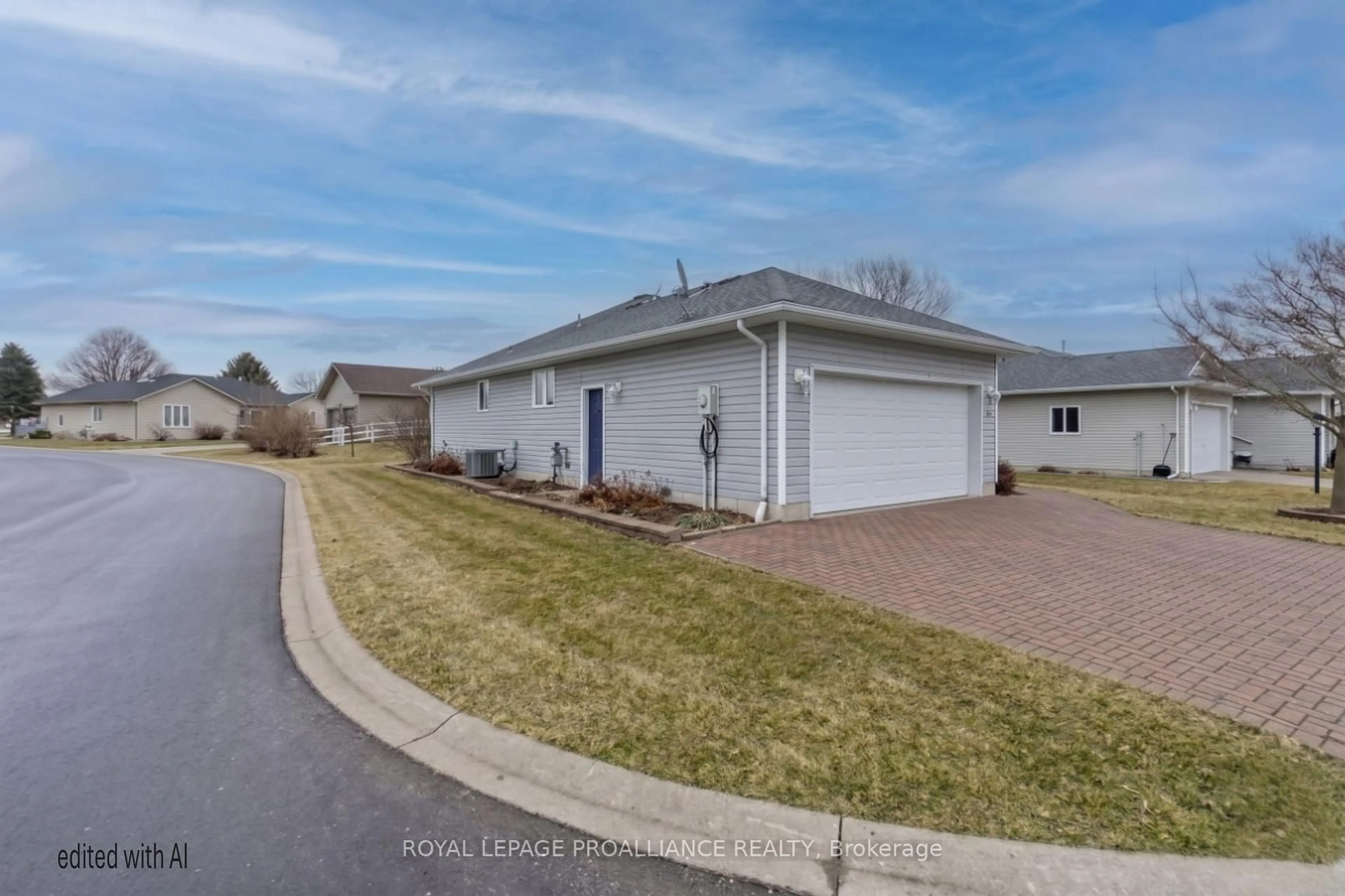 A pic from outside/outdoor area/front of a property/back of a property/a pic from drone, street for 94 Sandbanks Crt, Prince Edward County Ontario K0K 3L0