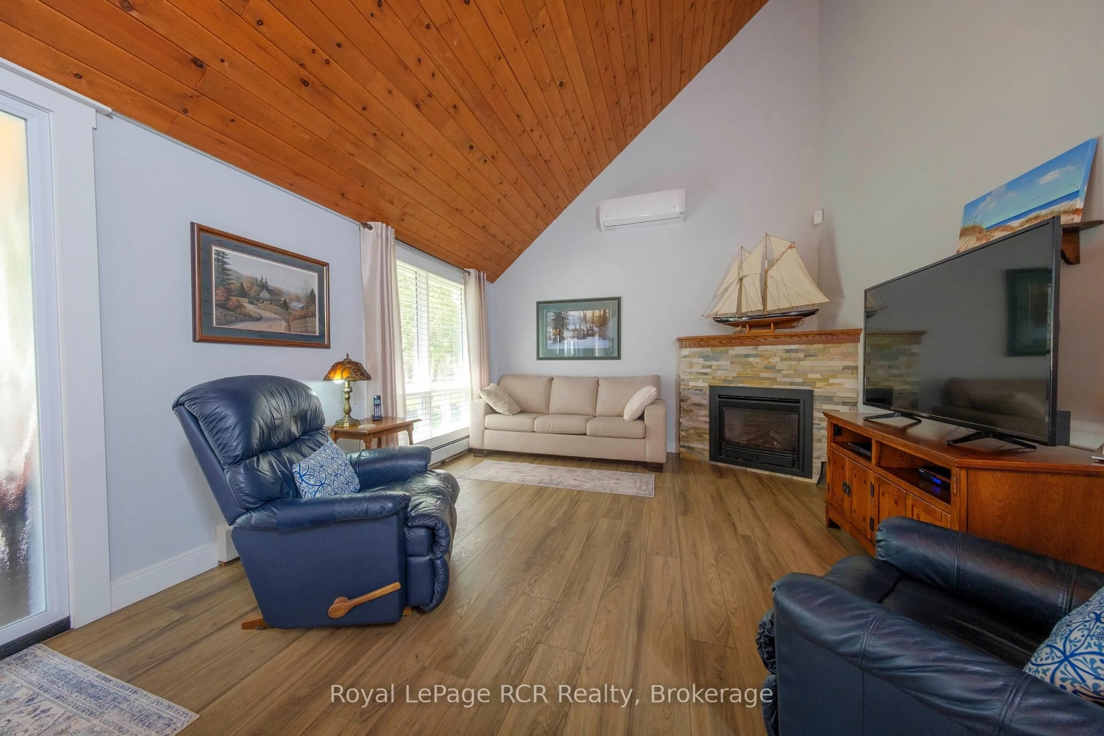 Living room with furniture, wood/laminate floor for 14 Whippoorwill Lane, Kincardine Ontario N2Z 2X6