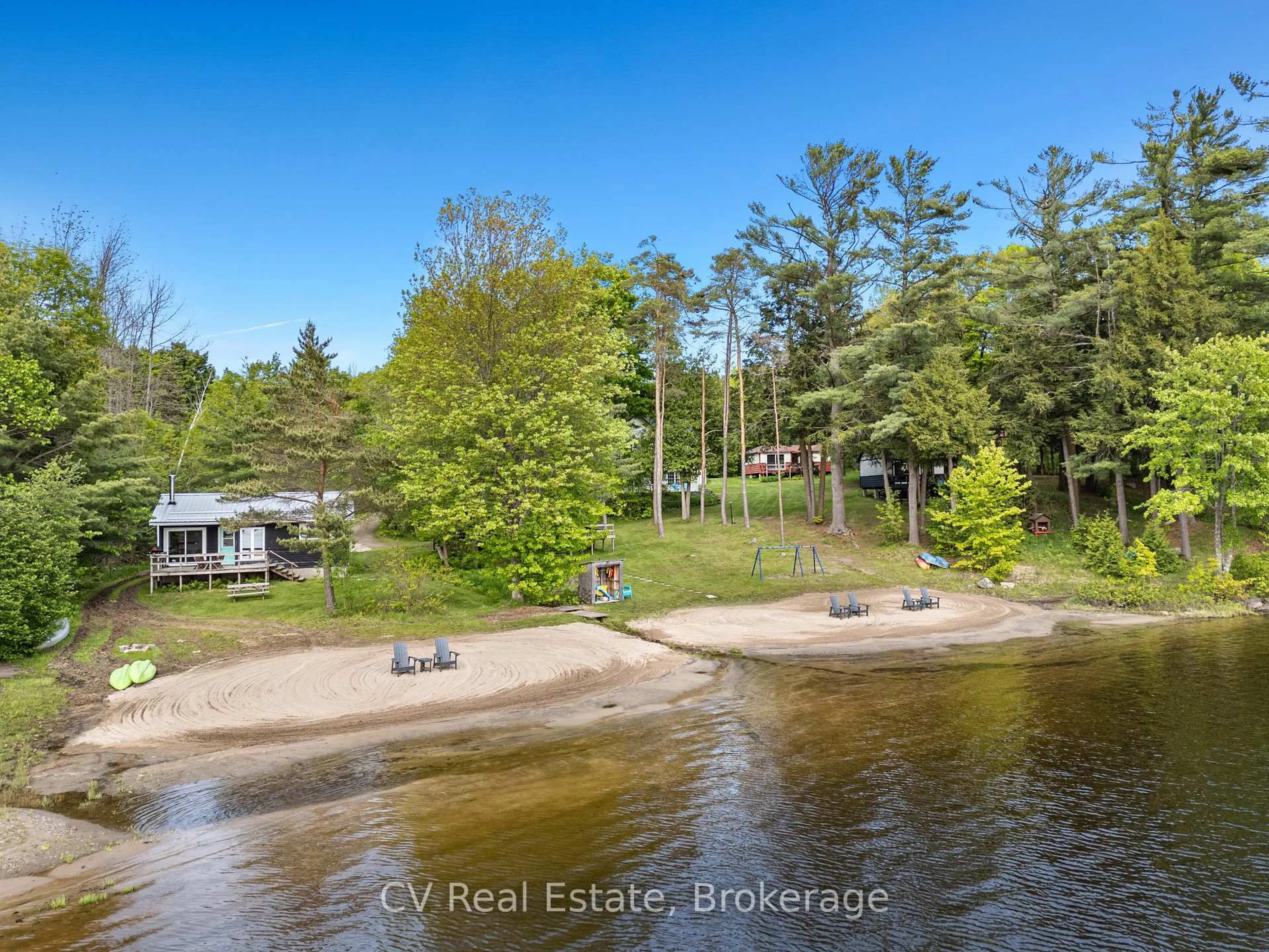 A pic from outside/outdoor area/front of a property/back of a property/a pic from drone, water/lake/river/ocean view for 1113 Moon River Rd, Muskoka Lakes Ontario P0C 1A0