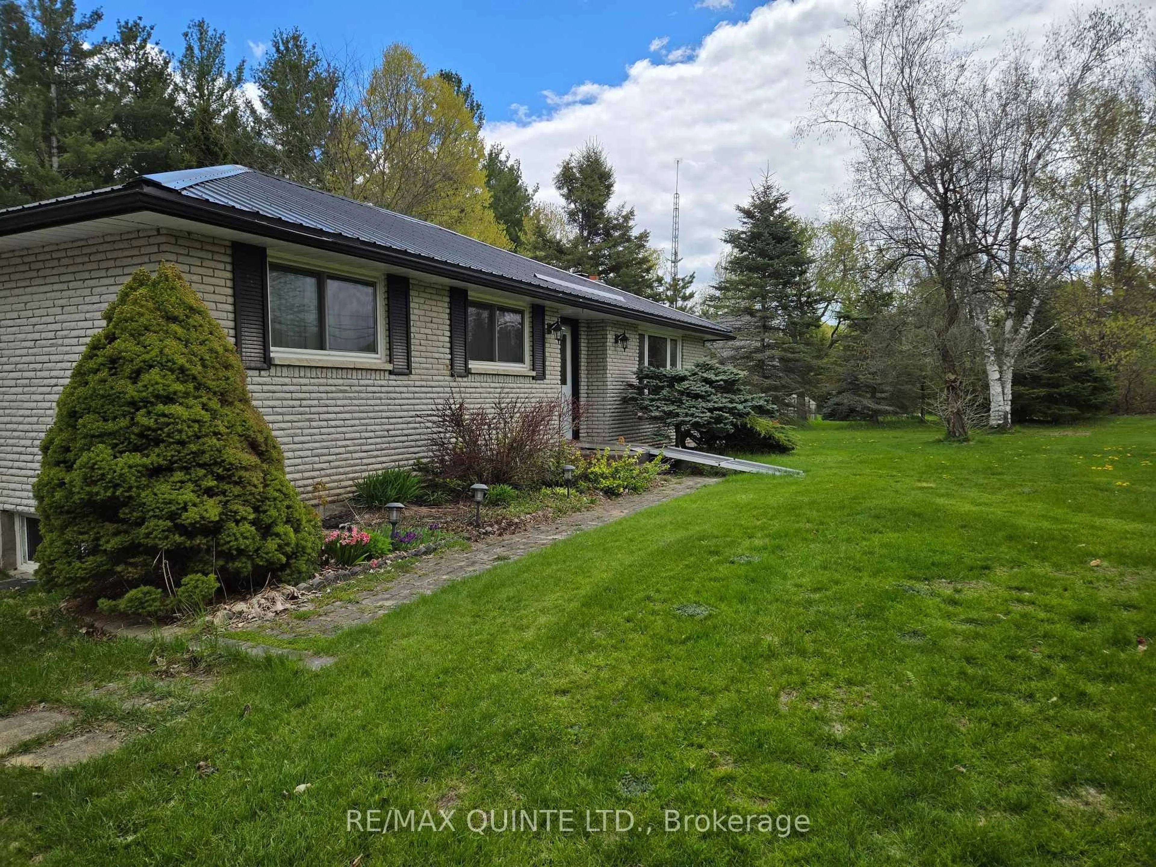 A pic from outside/outdoor area/front of a property/back of a property/a pic from drone, water/lake/river/ocean view for 12180 HIGHWAY 62, Madoc Ontario K0K 2K0