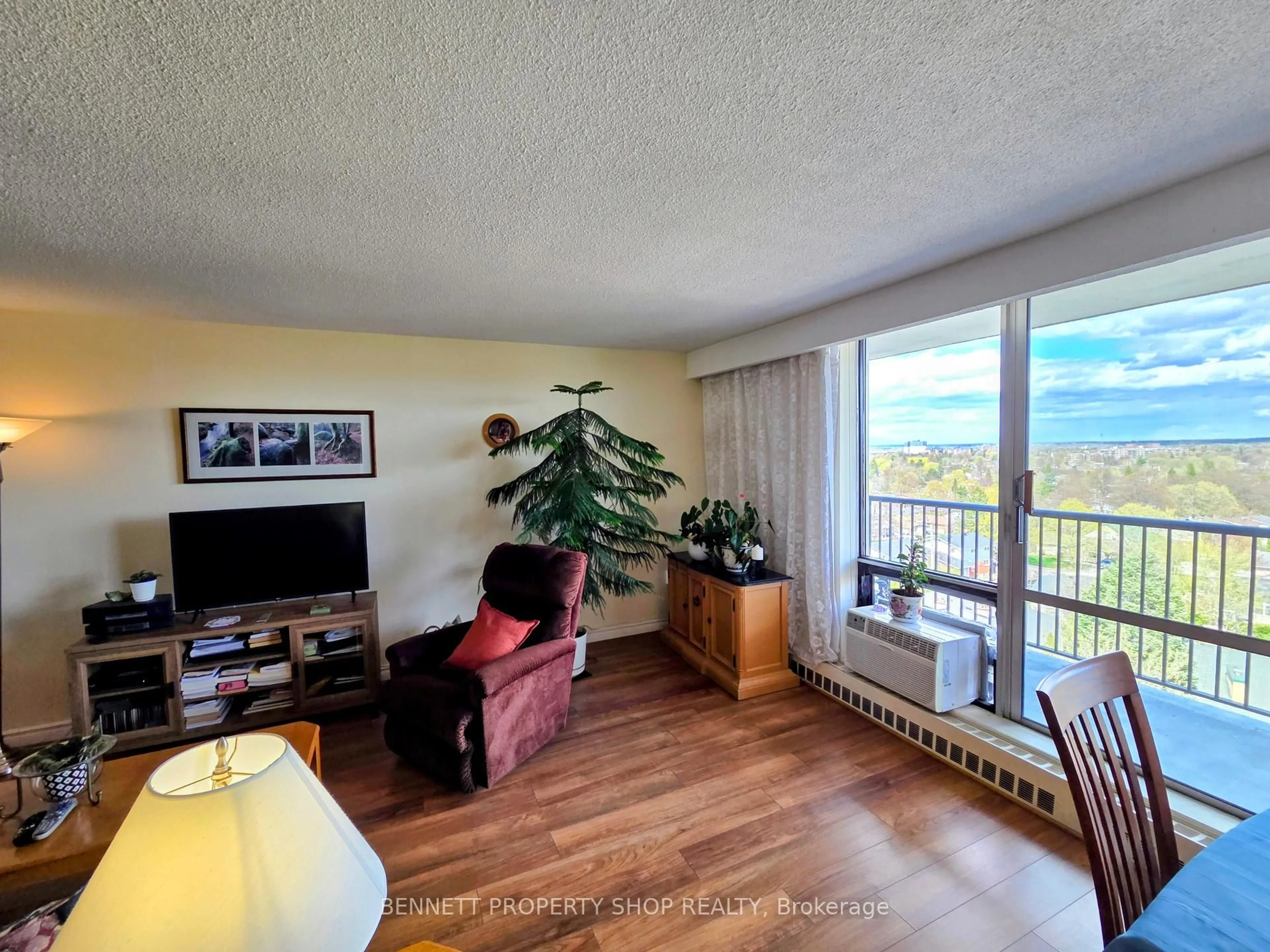 Living room with furniture, wood/laminate floor for 2400 Virginia Dr #1007, Ottawa Ontario K1H 8L3