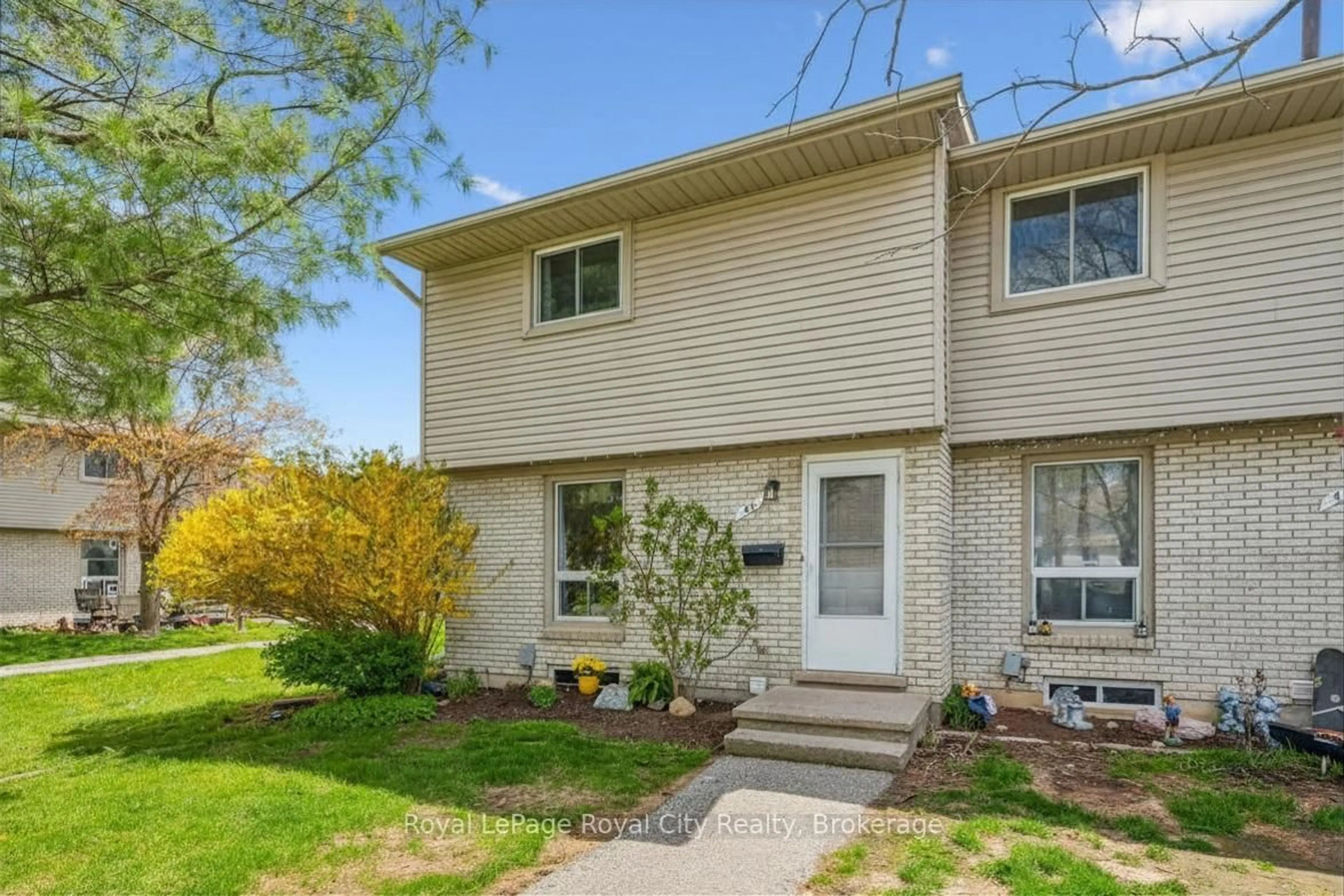 Home with vinyl exterior material, street for 700 Paisley Rd #42, Guelph Ontario N1K 1A3