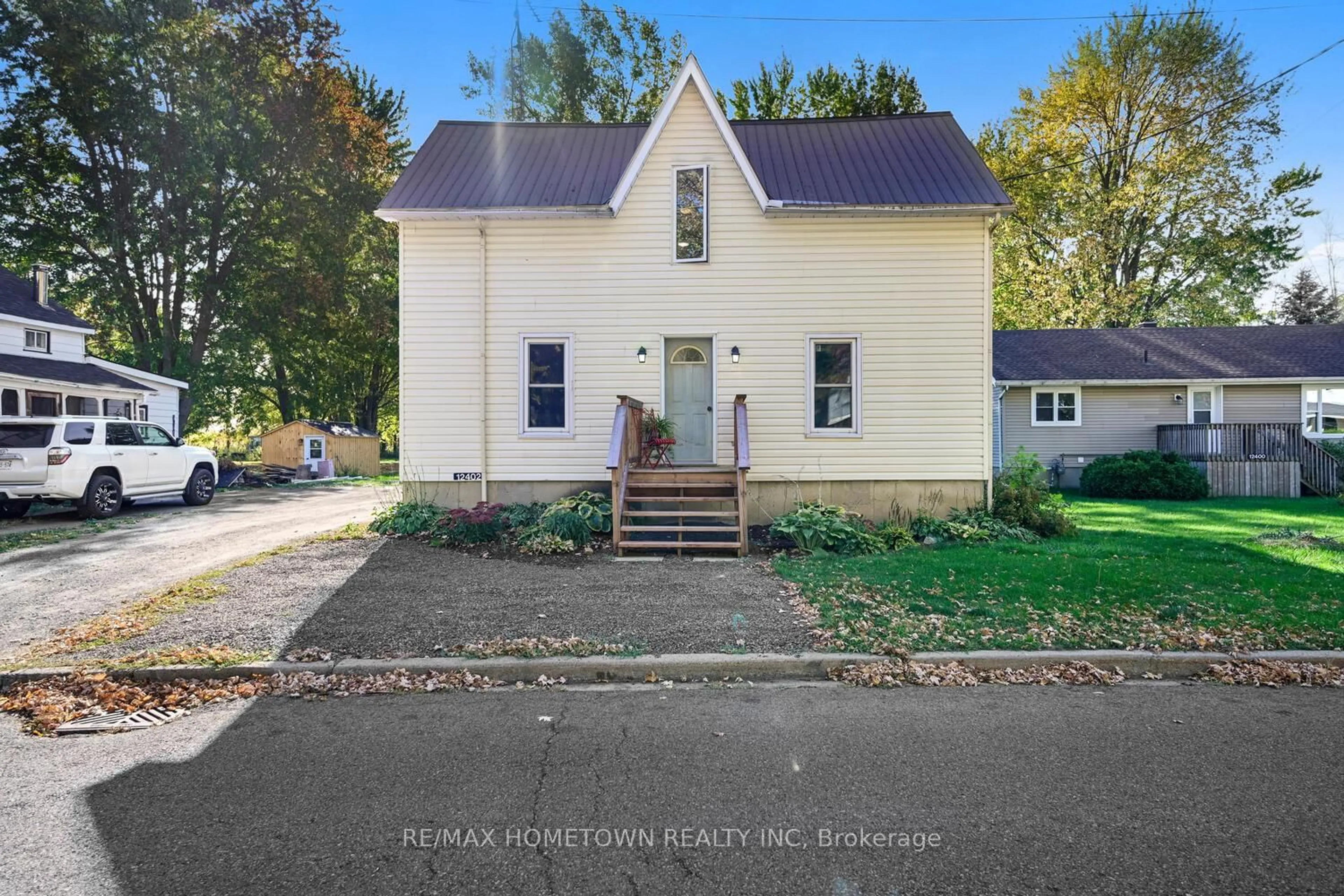 A pic from outside/outdoor area/front of a property/back of a property/a pic from drone, street for 12402 County Road 18 Rd, South Dundas Ontario K0C 2H0