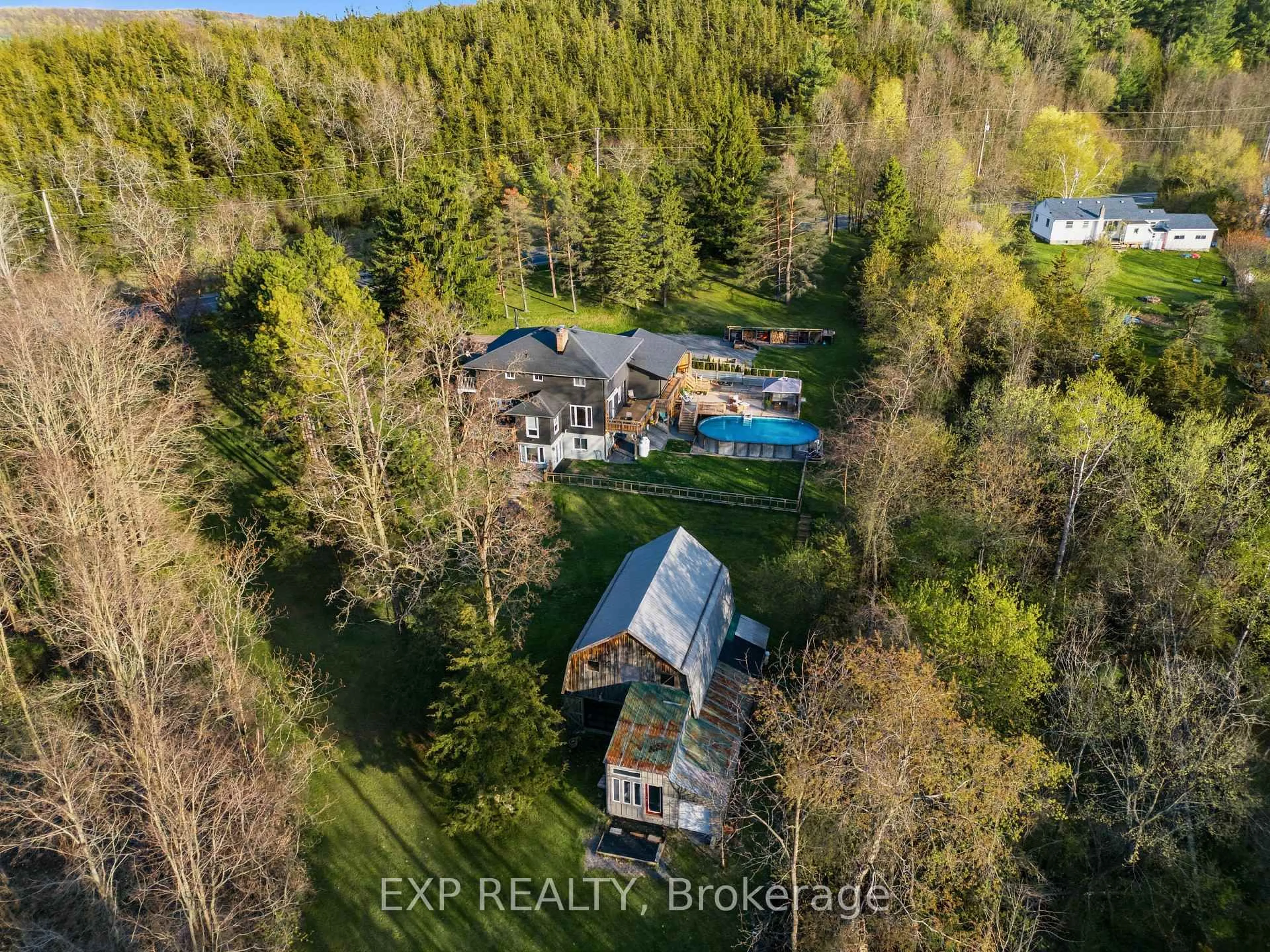 A pic from outside/outdoor area/front of a property/back of a property/a pic from drone, forest/trees view for 1852 Stockdale Rd, Campbellford Ontario K0K 3K0