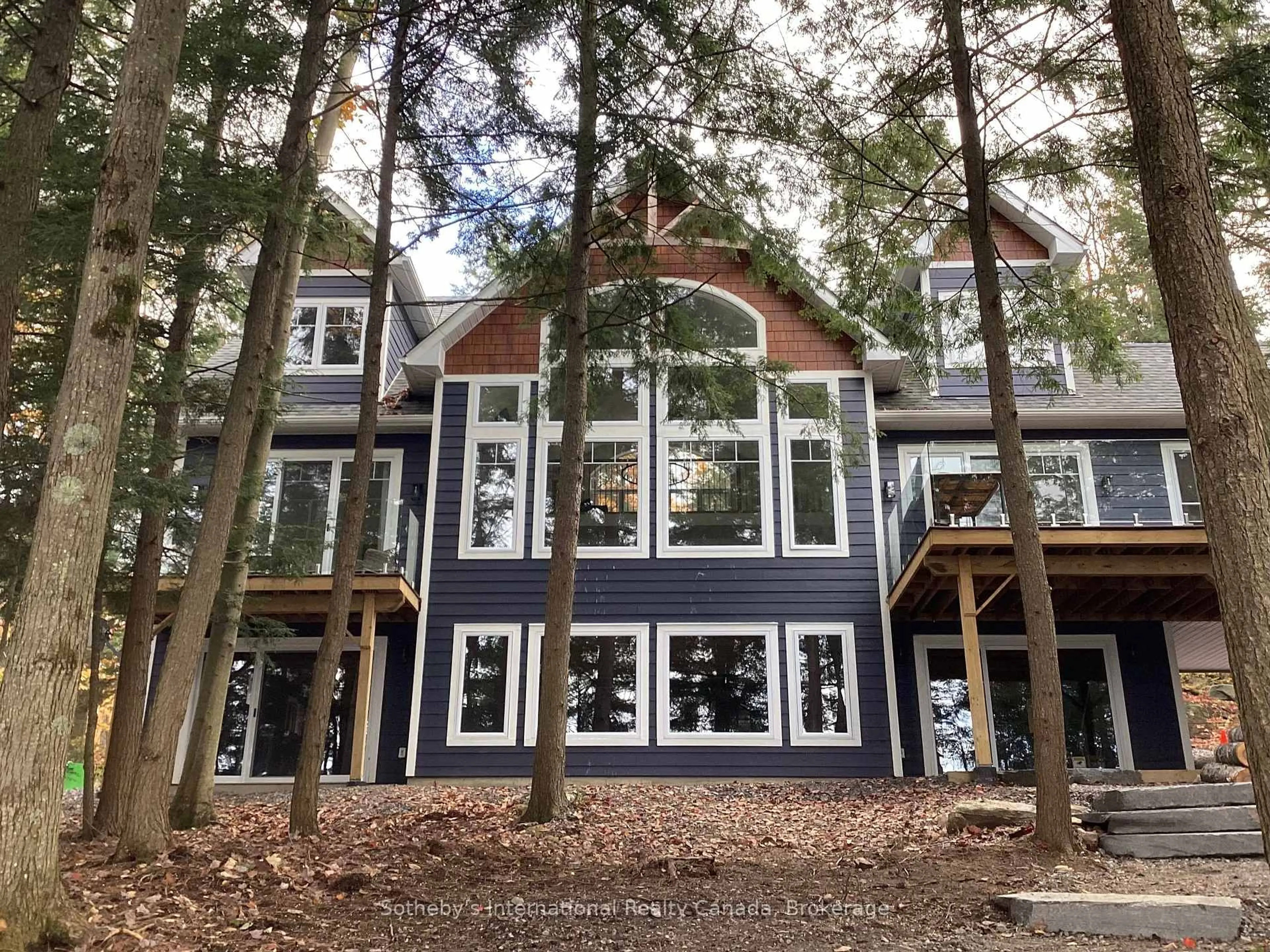 Home with vinyl exterior material, forest/trees view for 8091 Lake Joseph Rd #6, Muskoka Lakes Ontario P0C 1H0