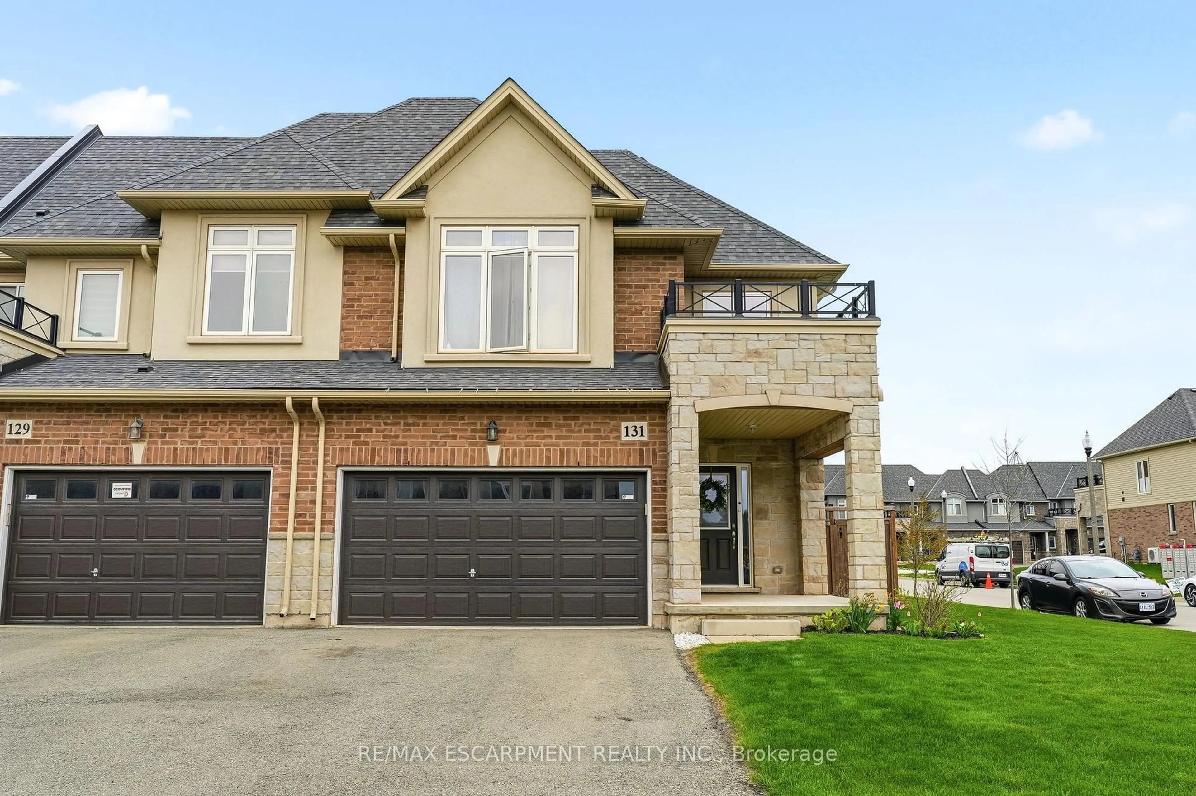 Home with brick exterior material, street for 131 Sonoma Lane, Hamilton Ontario L8E 0J9