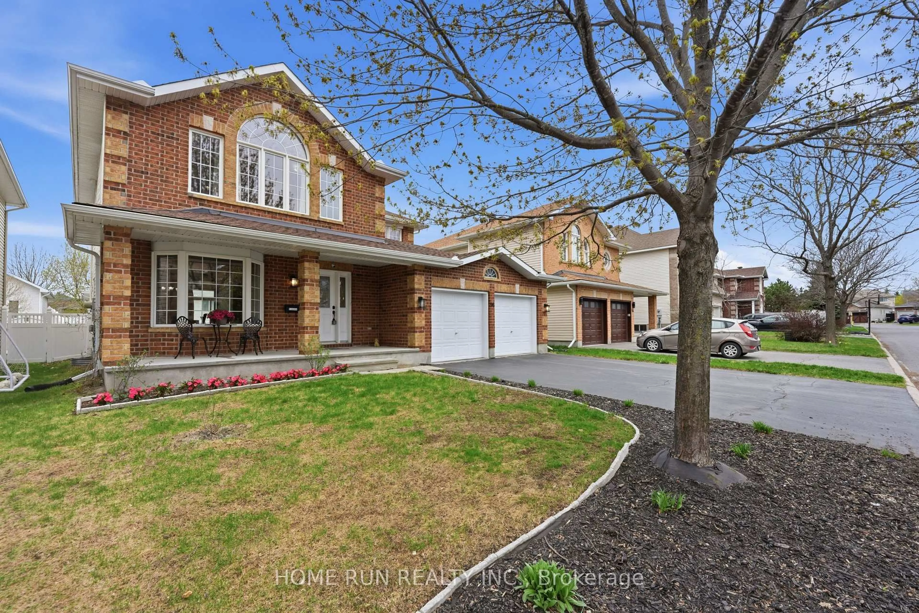 Home with brick exterior material, street for 96 Woliston Cres, Kanata Ontario K2W 1G2