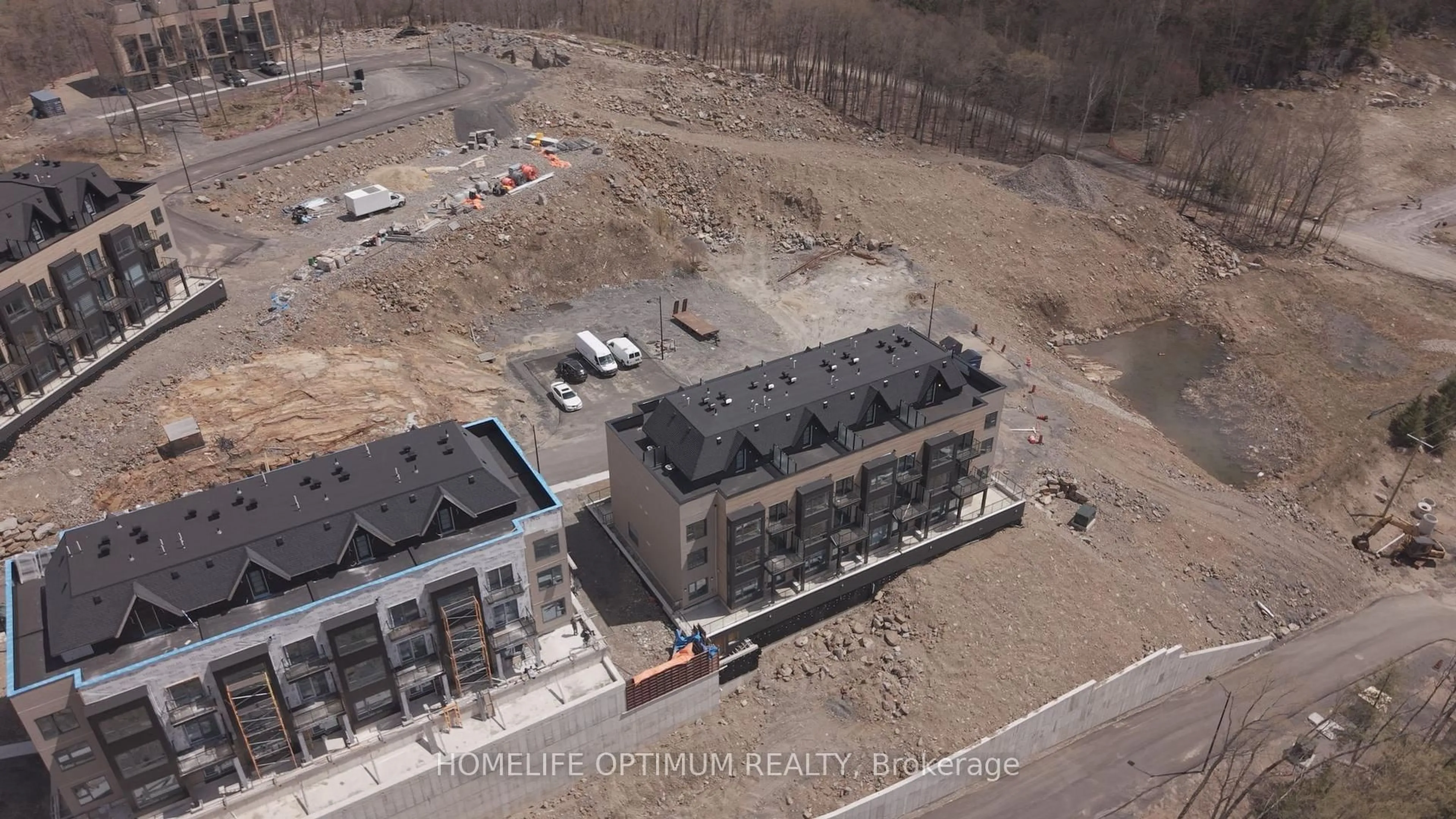 A pic from outside/outdoor area/front of a property/back of a property/a pic from drone, building for 12 Suncrest Lane #204, Huntsville Ontario P1H 1G1
