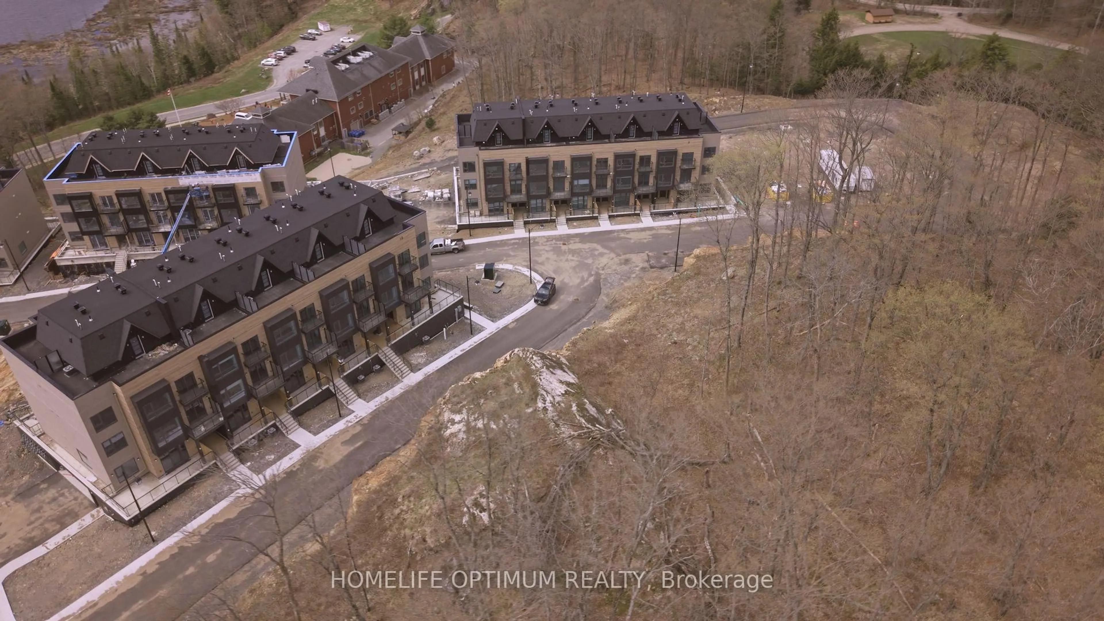 A pic from outside/outdoor area/front of a property/back of a property/a pic from drone, street for 6 Suncrest Lane #101, Huntsville Ontario P1H 0K3