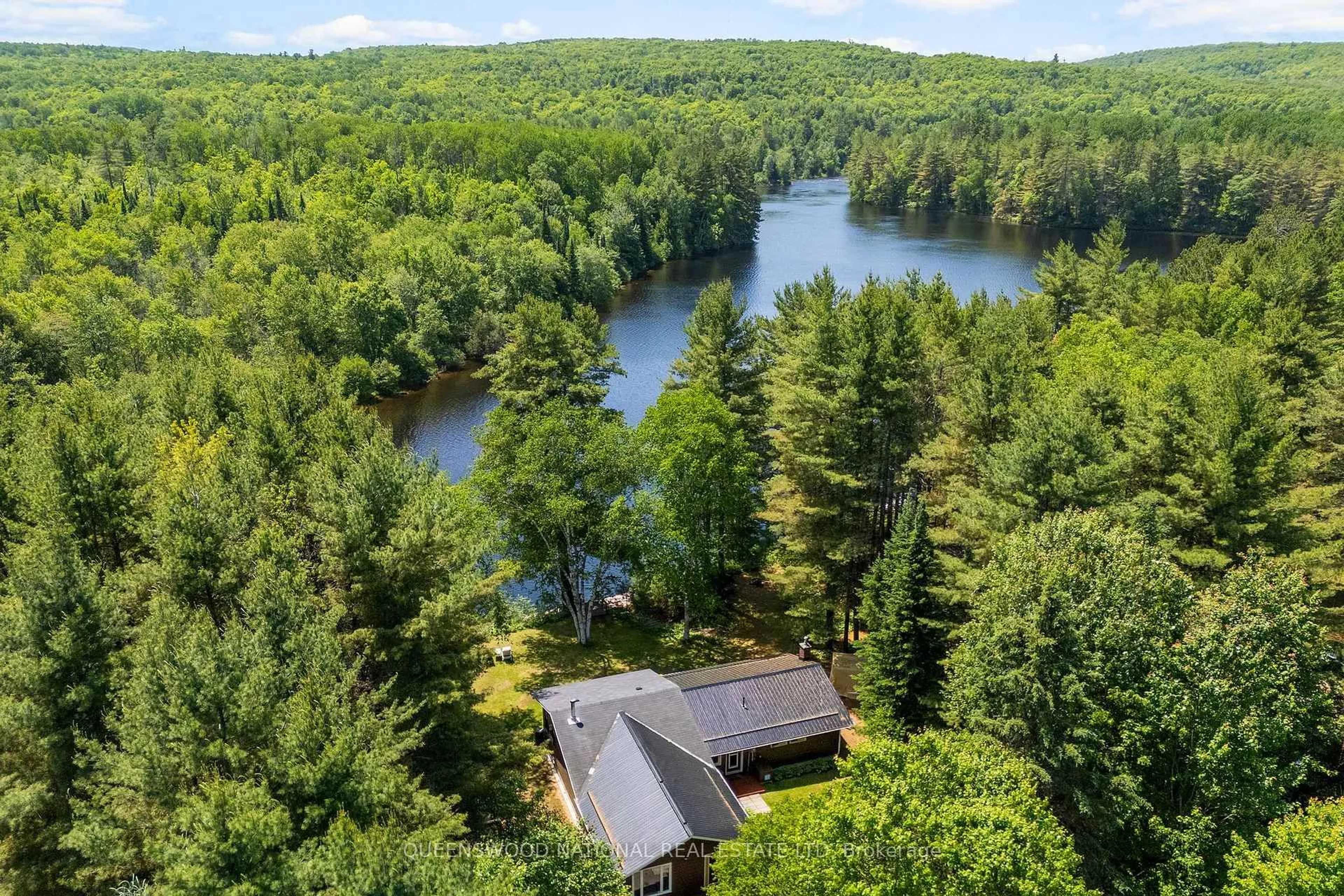 A pic from outside/outdoor area/front of a property/back of a property/a pic from drone, water/lake/river/ocean view for 618 River Rd, Barry's Bay Ontario K0J 1B0