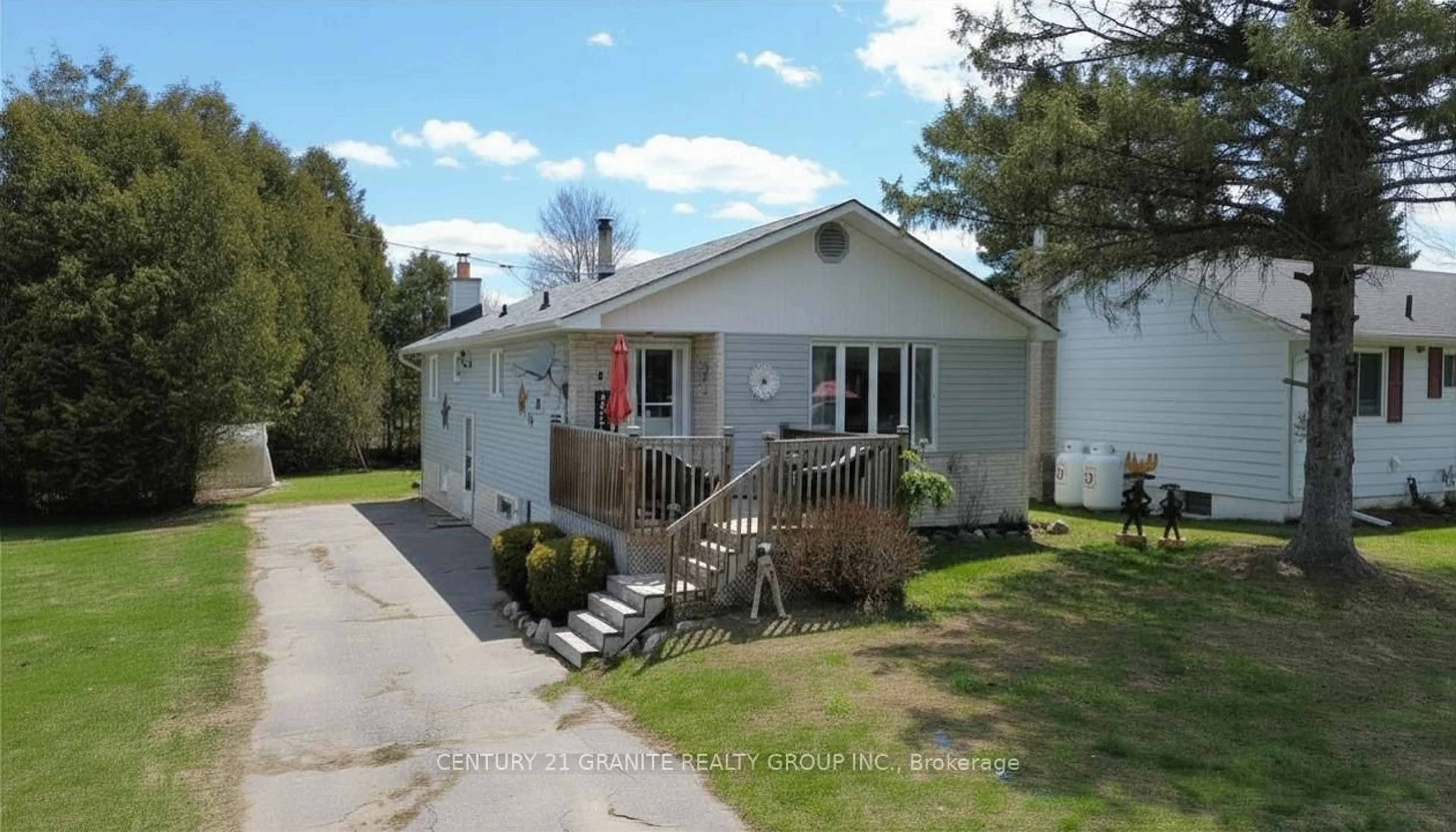 Home with vinyl exterior material, street for 2 Hemlock St, Highlands East Ontario K0L 1M0