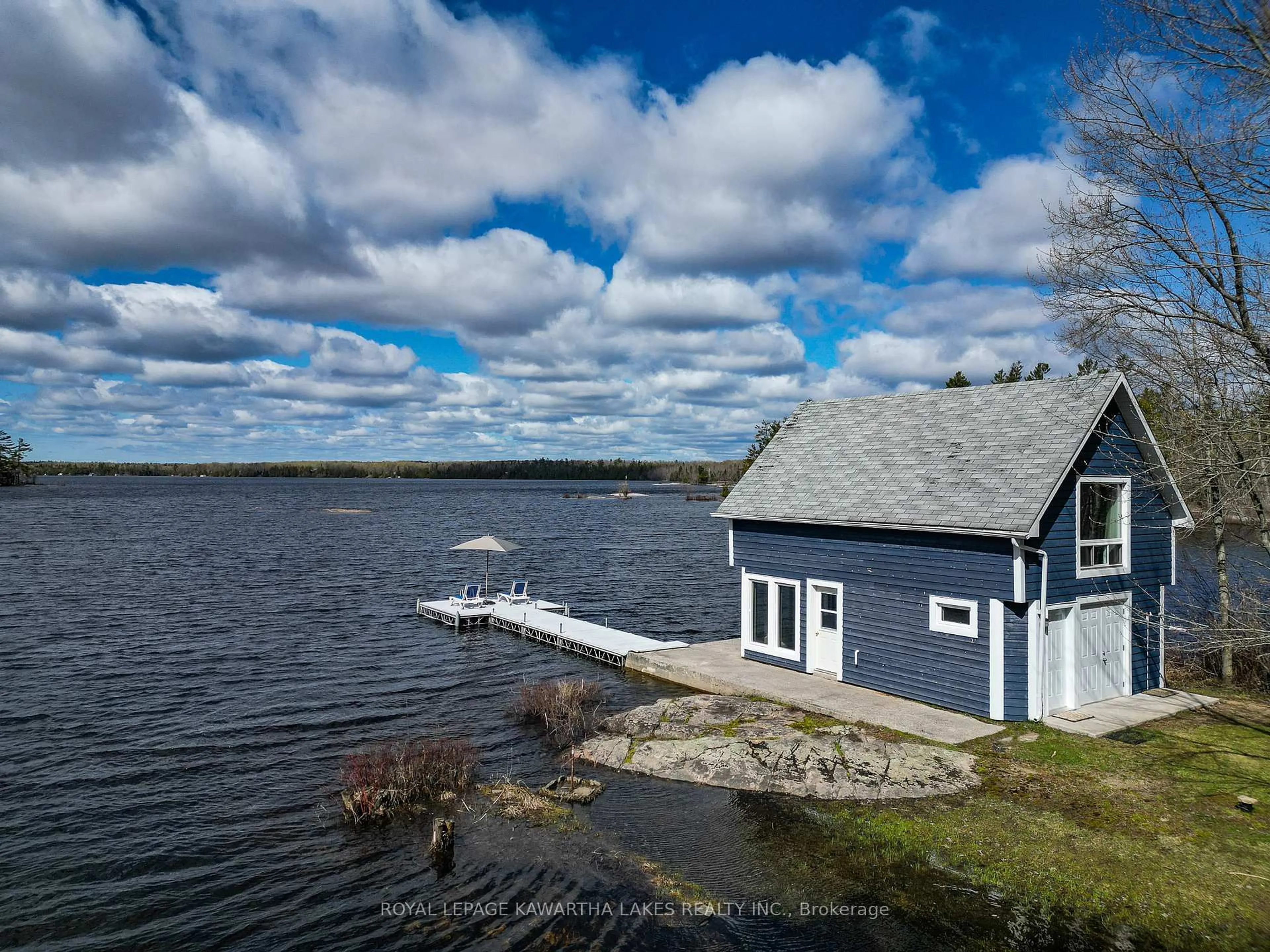 A pic from outside/outdoor area/front of a property/back of a property/a pic from drone, water/lake/river/ocean view for 11 Woodworth Dr, Kawartha Lakes Ontario K0M 1C0