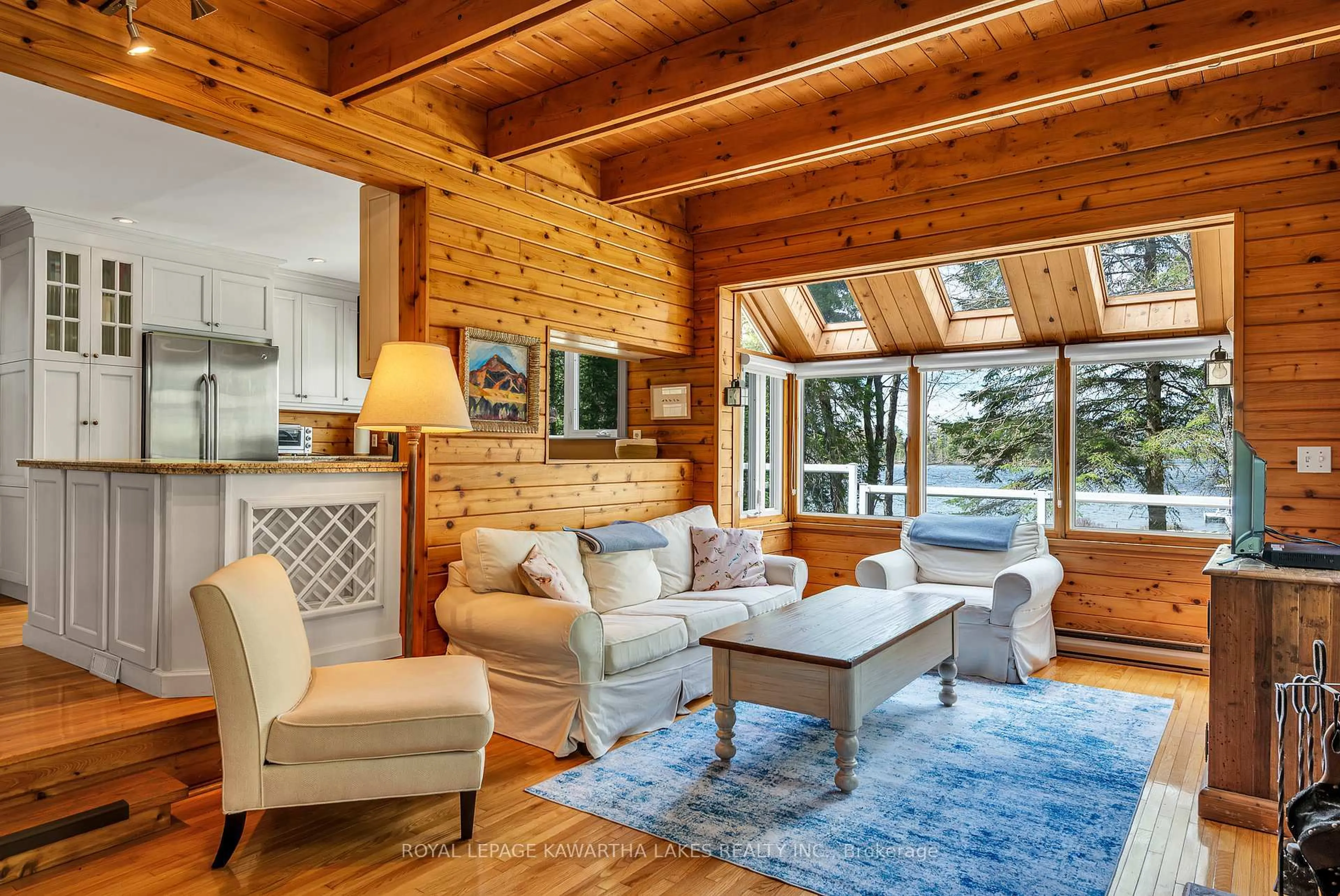 Living room with furniture, wood/laminate floor for 11 Woodworth Dr, Kawartha Lakes Ontario K0M 1C0