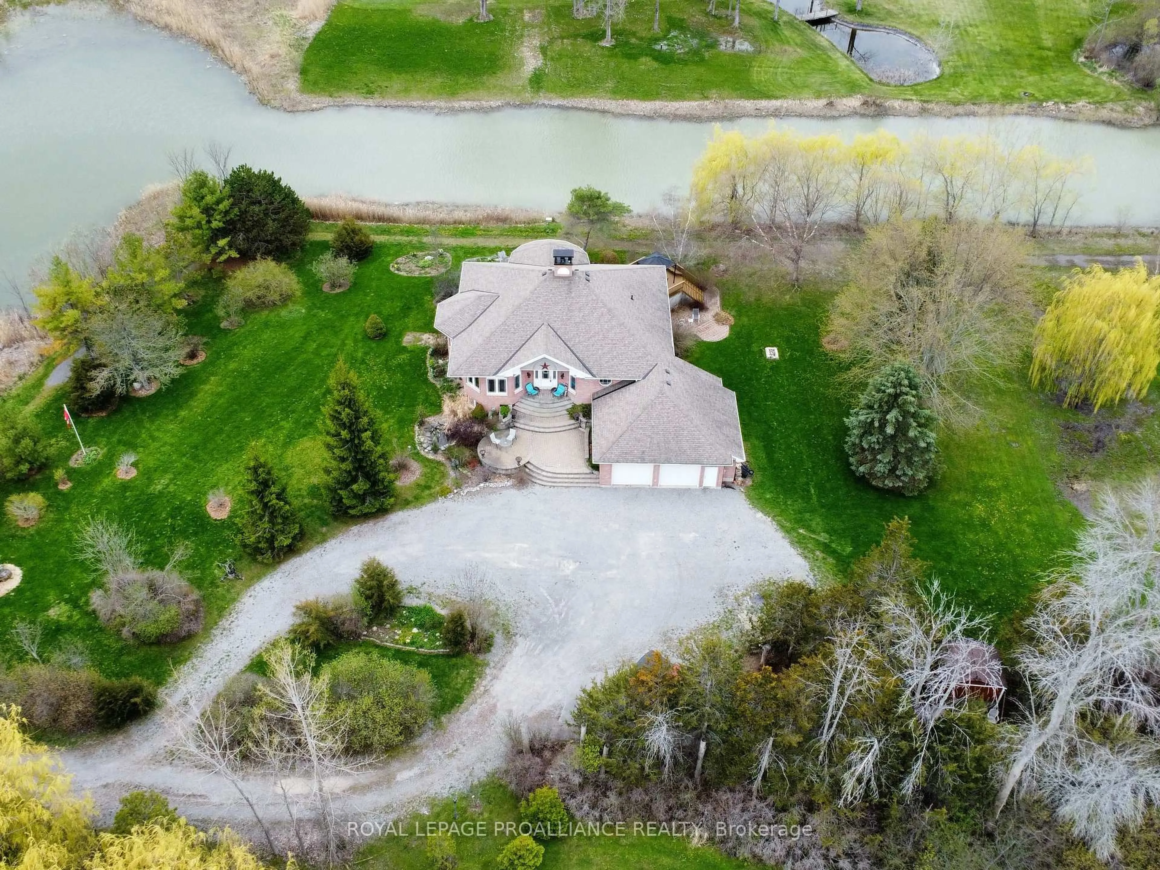 A pic from outside/outdoor area/front of a property/back of a property/a pic from drone, water/lake/river/ocean view for 1049 County Road 23, Prince Edward County Ontario K8N 4Z1