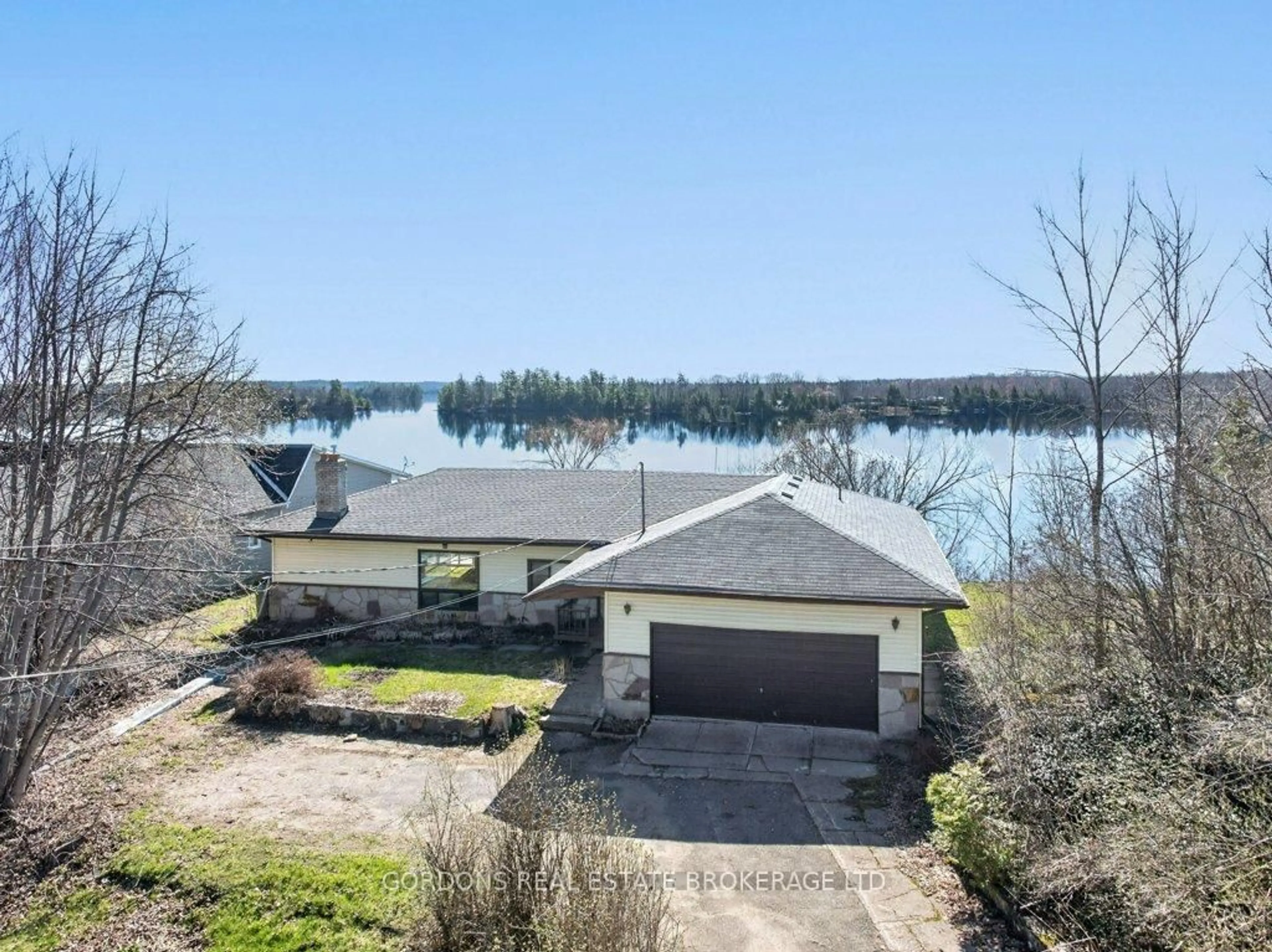 A pic from outside/outdoor area/front of a property/back of a property/a pic from drone, water/lake/river/ocean view for 14140 Highway 38, Sharbot Lake Ontario K0H 2P0