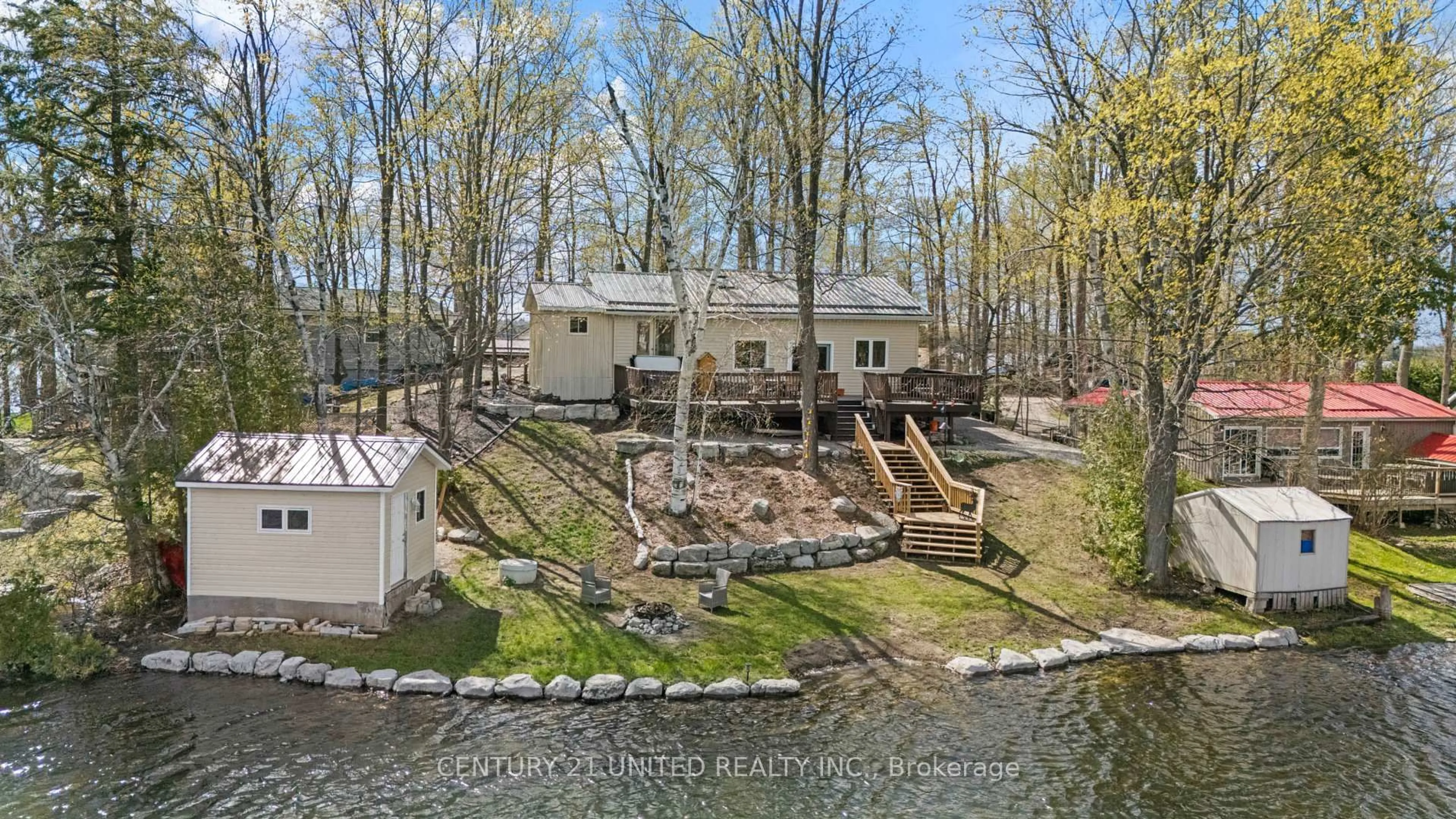 A pic from outside/outdoor area/front of a property/back of a property/a pic from drone, water/lake/river/ocean view for 219 Rollies Point Rd, Curve Lake First Nation 35 Ontario K0L 1R0