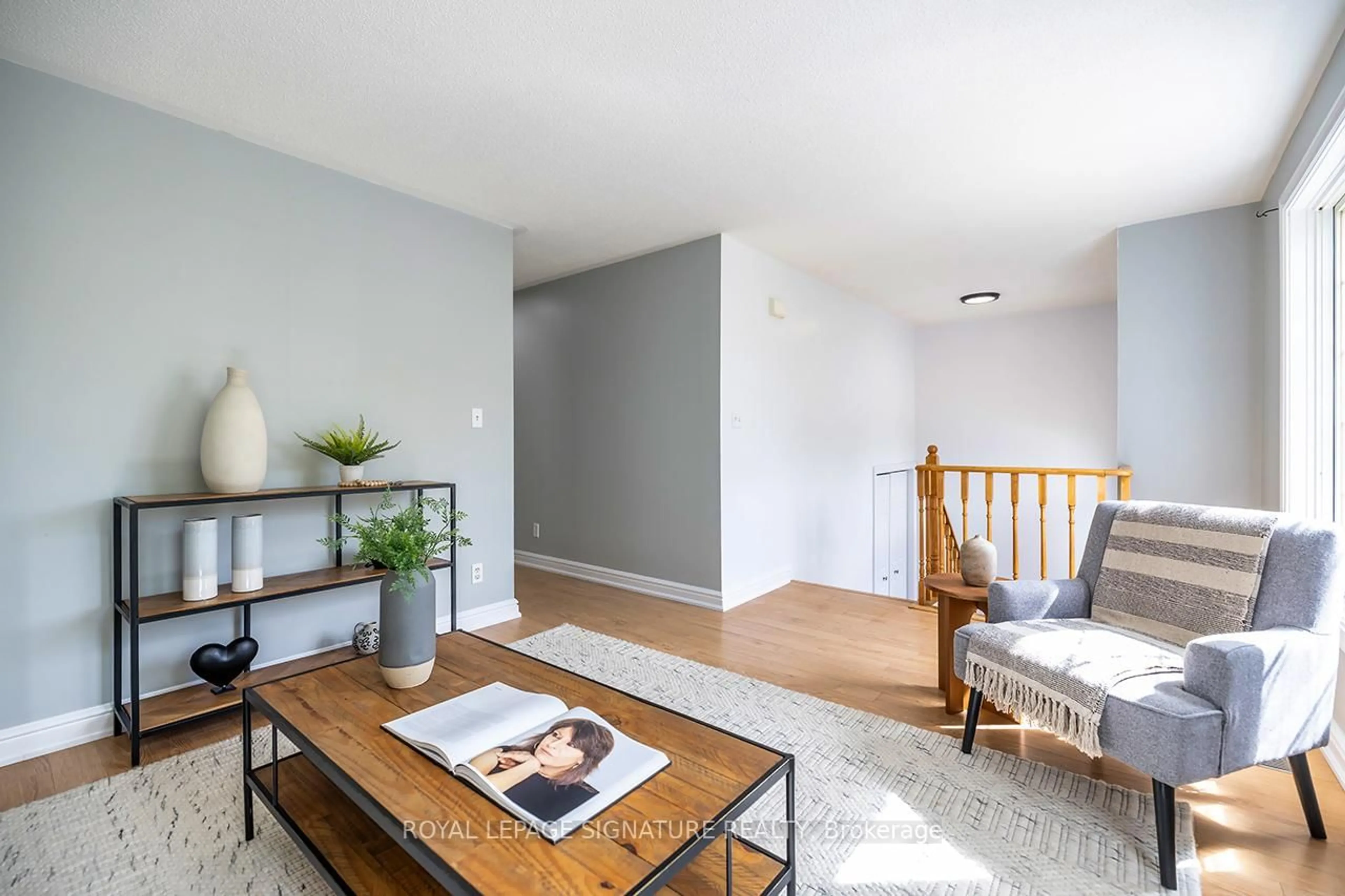 Living room with furniture, wood/laminate floor for 23 Faraday Gdns, Belleville Ontario K8P 5J5