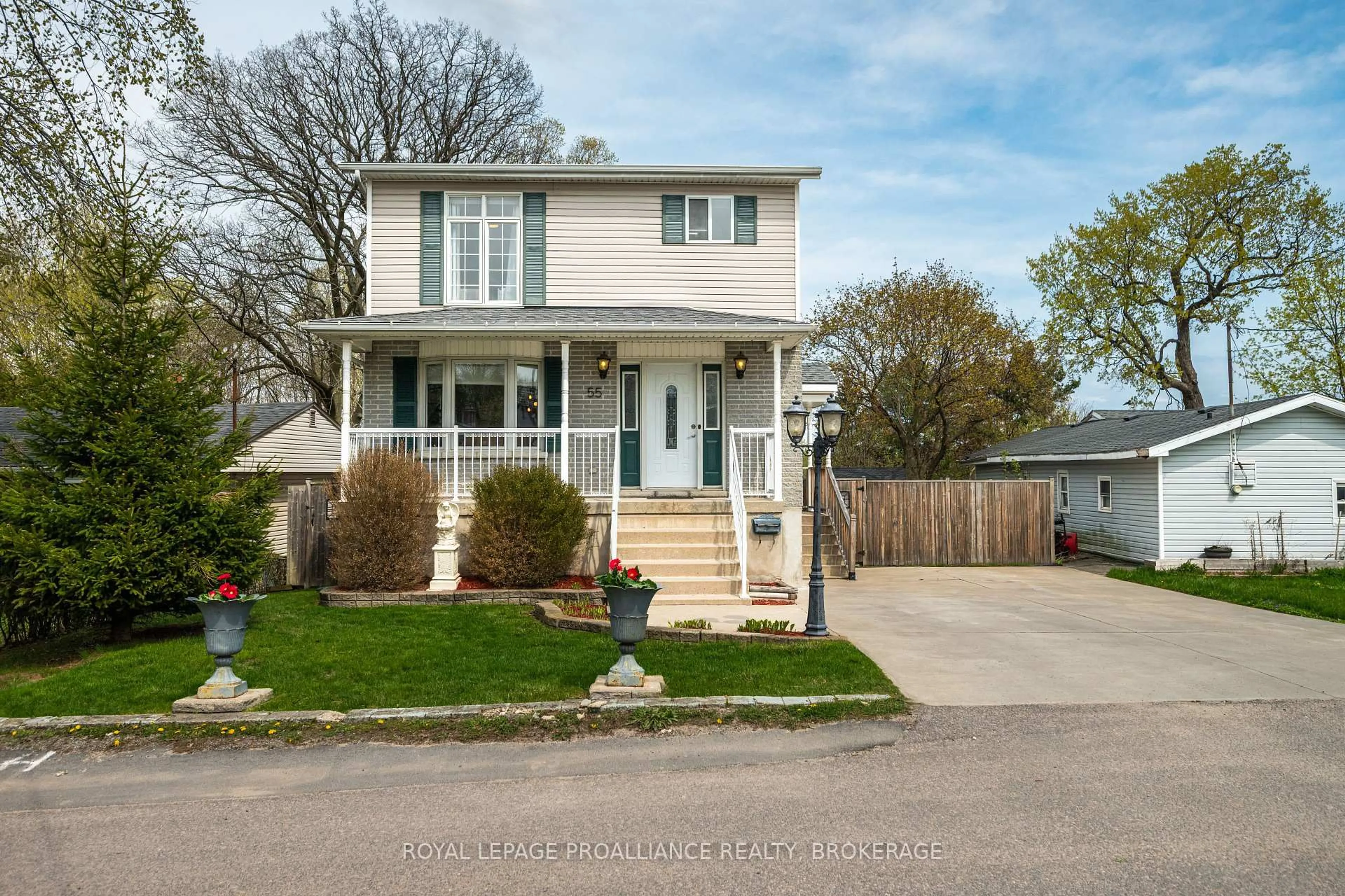 Home with vinyl exterior material, street for 55 Shaw St, Kingston Ontario K7K 4Y5