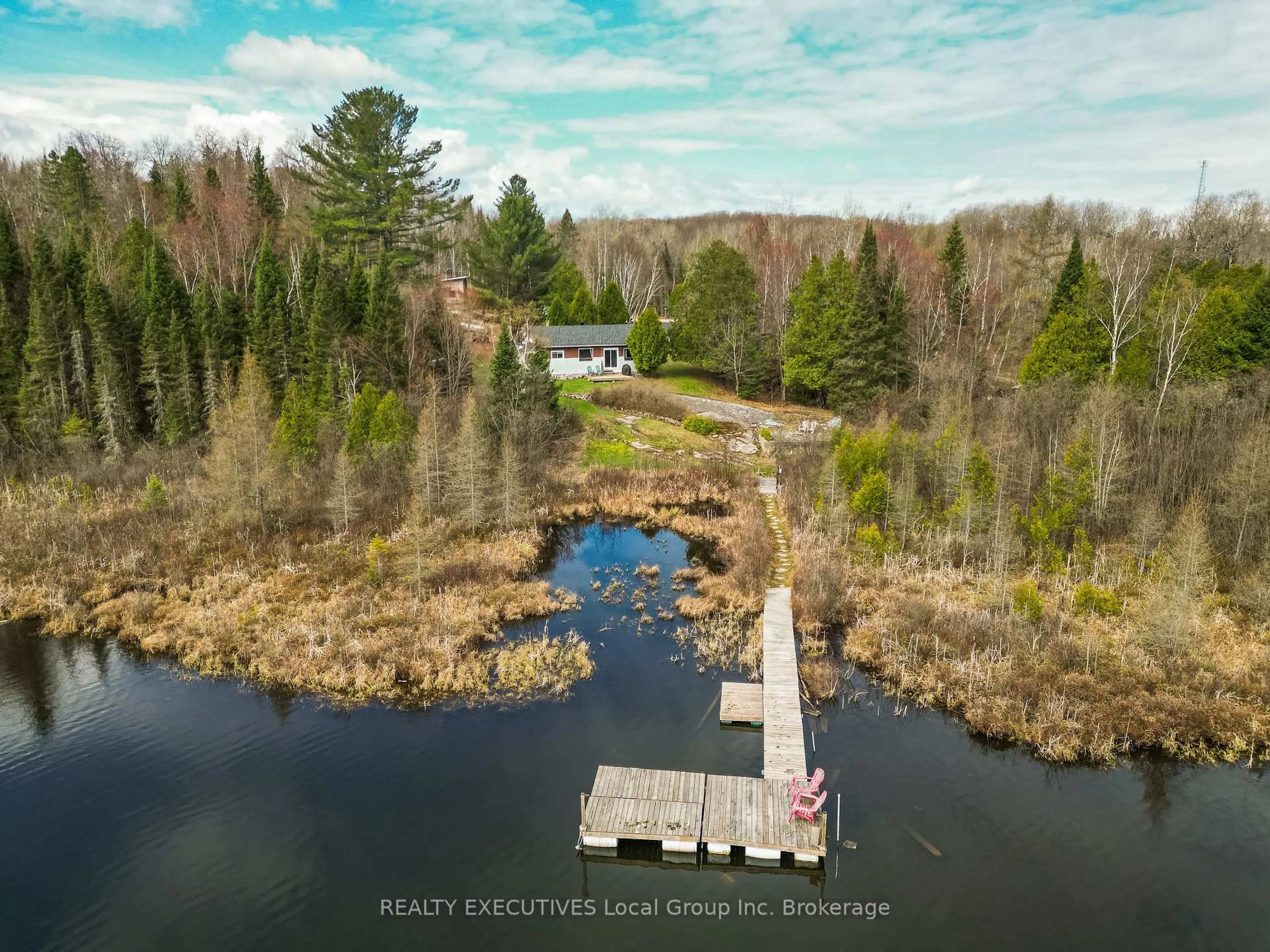 A pic from outside/outdoor area/front of a property/back of a property/a pic from drone, water/lake/river/ocean view for 115 Hillside Ave, Bonfield Ontario P0H 1E0