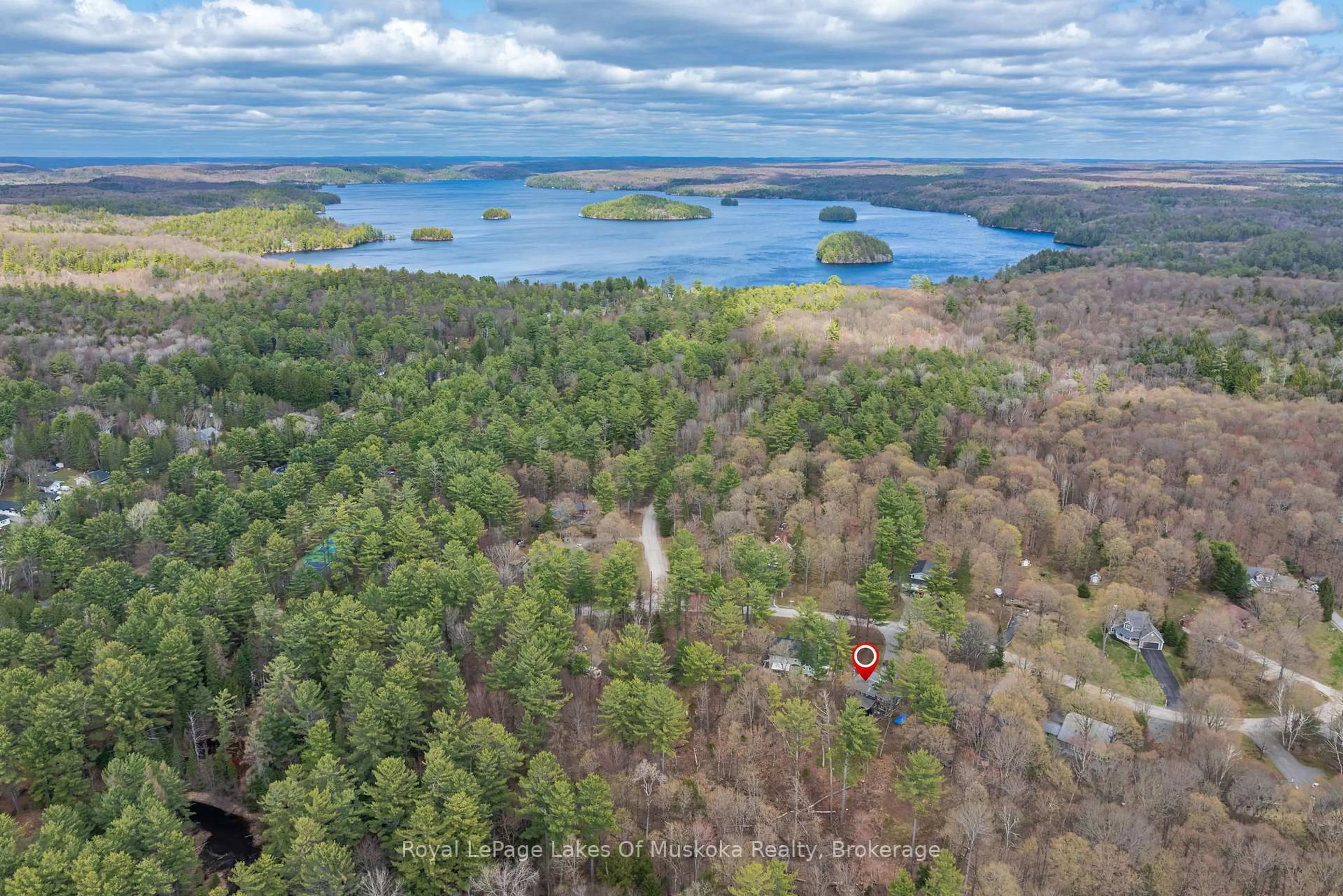 A pic from outside/outdoor area/front of a property/back of a property/a pic from drone, water/lake/river/ocean view for 84 Clarke Cres, Huntsville Ontario P0B 1L0